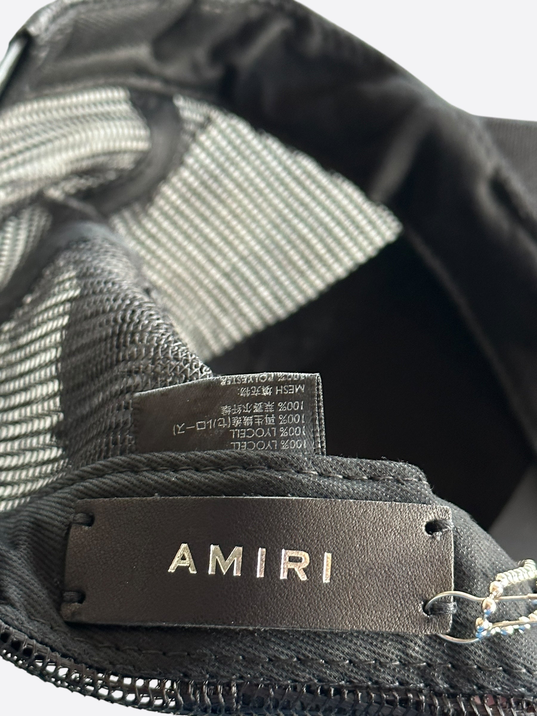 Amiri Black MA Paint Splatter Logo Trucker Hat - Stylish Distressed Baseball Cap for Men & Women - Perfect for Streetwear, Concerts, and Casual Outfits