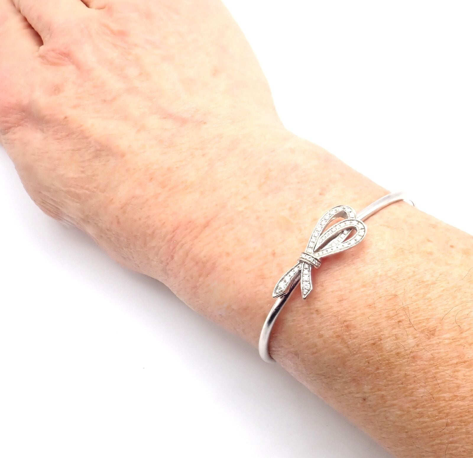 Authentic Tiffany & Co 18K White Gold Diamond Bow Ribbon Bangle Cuff Bracelet - Elegant Jewelry Gift for Women, Perfect for Weddings, Anniversaries & Special Occasions