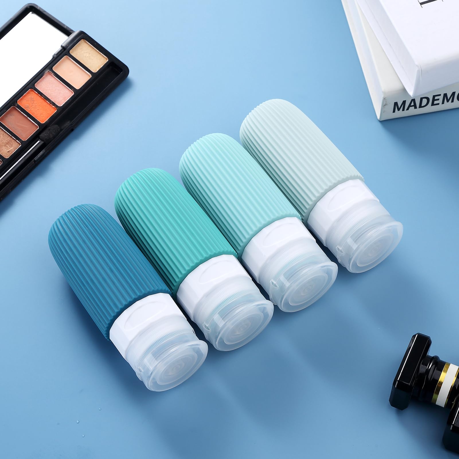 TSA Approved 2oz Travel Bottles for Toiletries - BPA Free Leak Proof Refillable Containers with Toiletry Bag (4 Pack) - Perfect for Air Travel, Gym, Camping & Shampoo Storage