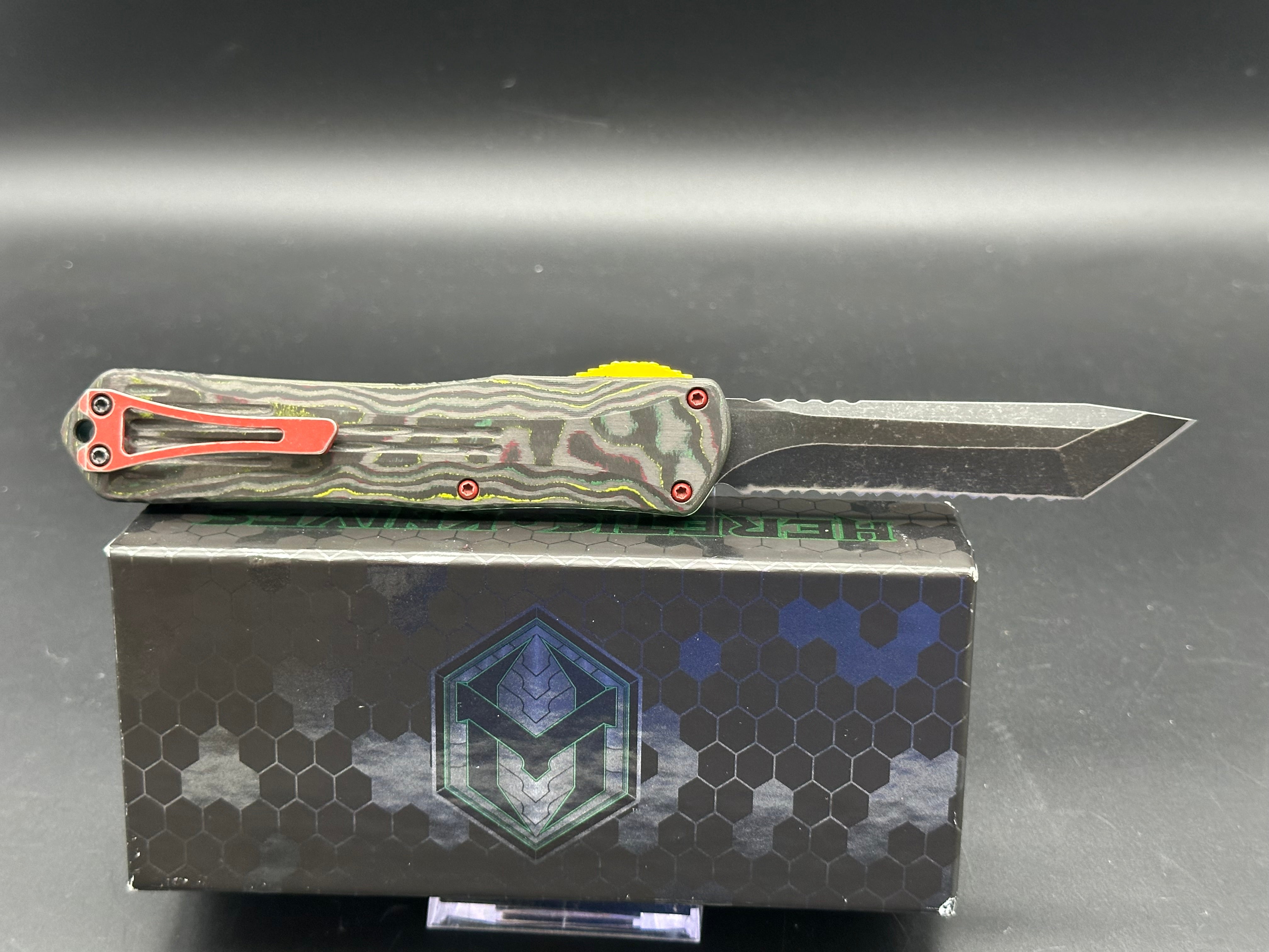 Heretic Manticore X Bounty Hunter Camo Carbon Handle OTF Knife - Black MagnaCut Serrated Tanto Blade for Tactical, Outdoor & EDC Use