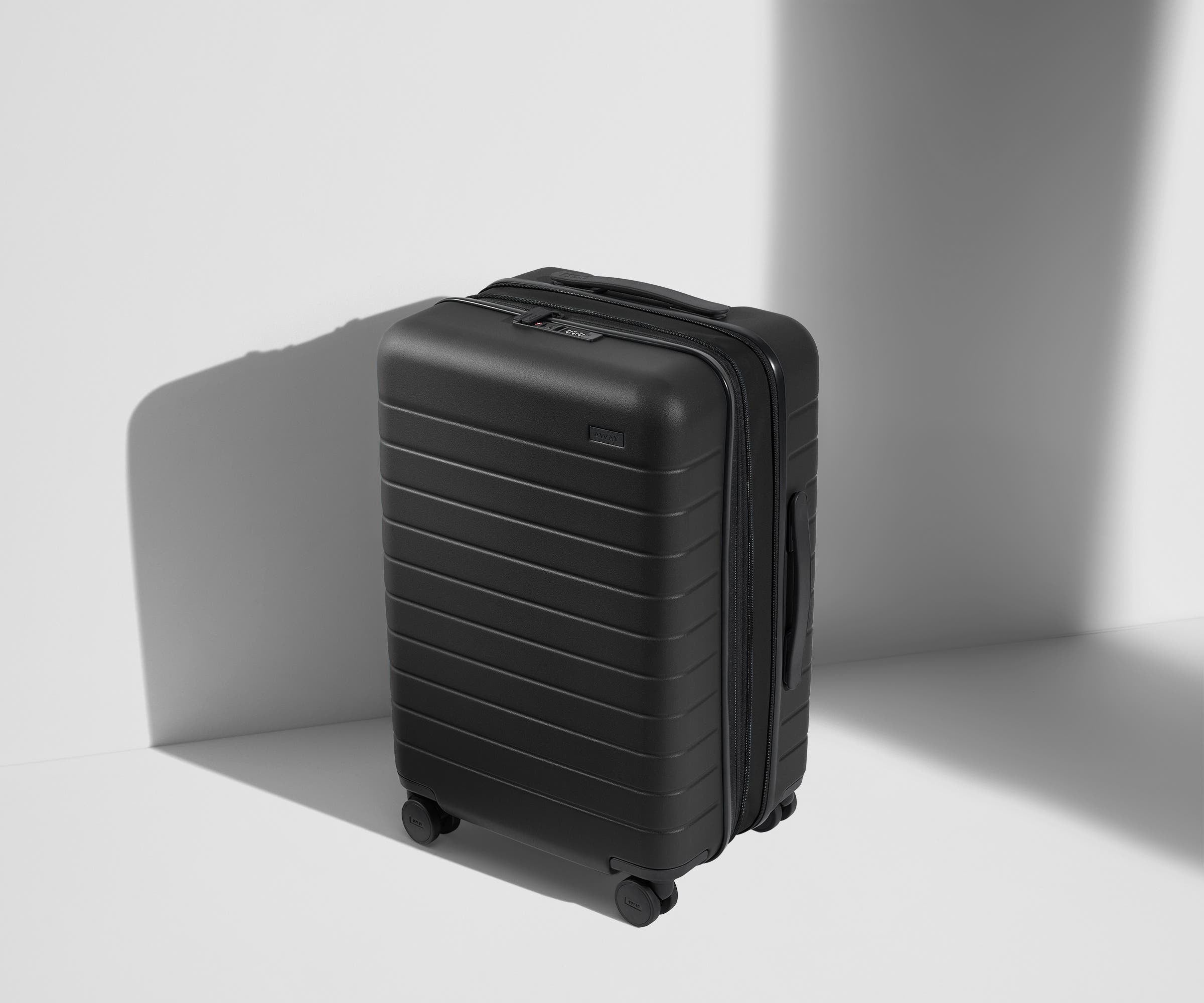 The Bigger Carry On Flex Suitcase - Jet Black Expandable Luggage for Travel & Business Trips | Lightweight & Durable Spinner Bag