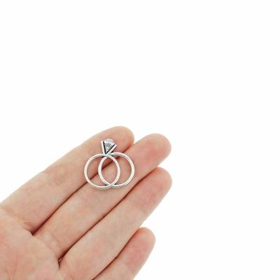 A Timeless Love: The Story of the Antique Silver Tone Wedding Ring Charms