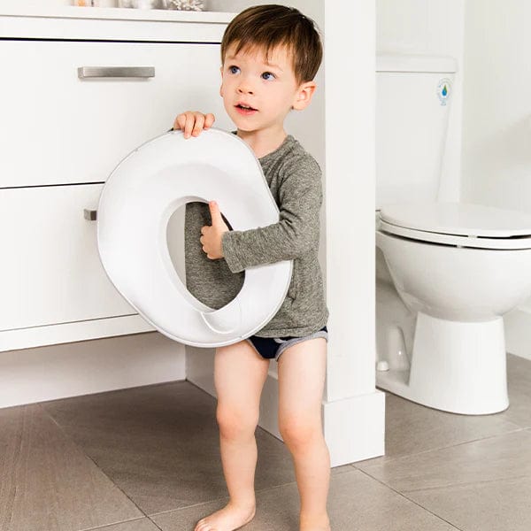 Ubbi Toilet Trainer for Toddlers - Potty Training Seat with Anti-Slip Design for Boys & Girls - Easy to Clean & Portable for Home & Travel Use