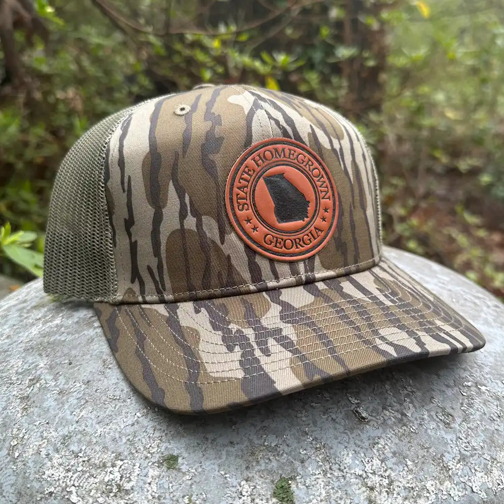 Georgia Pride Leather Patch Trucker Hat in Bottomland Camo - Vintage Distressed Baseball Cap with Adjustable Strap - Perfect for Hunting, Outdoor Adventures & State Pride Fashion