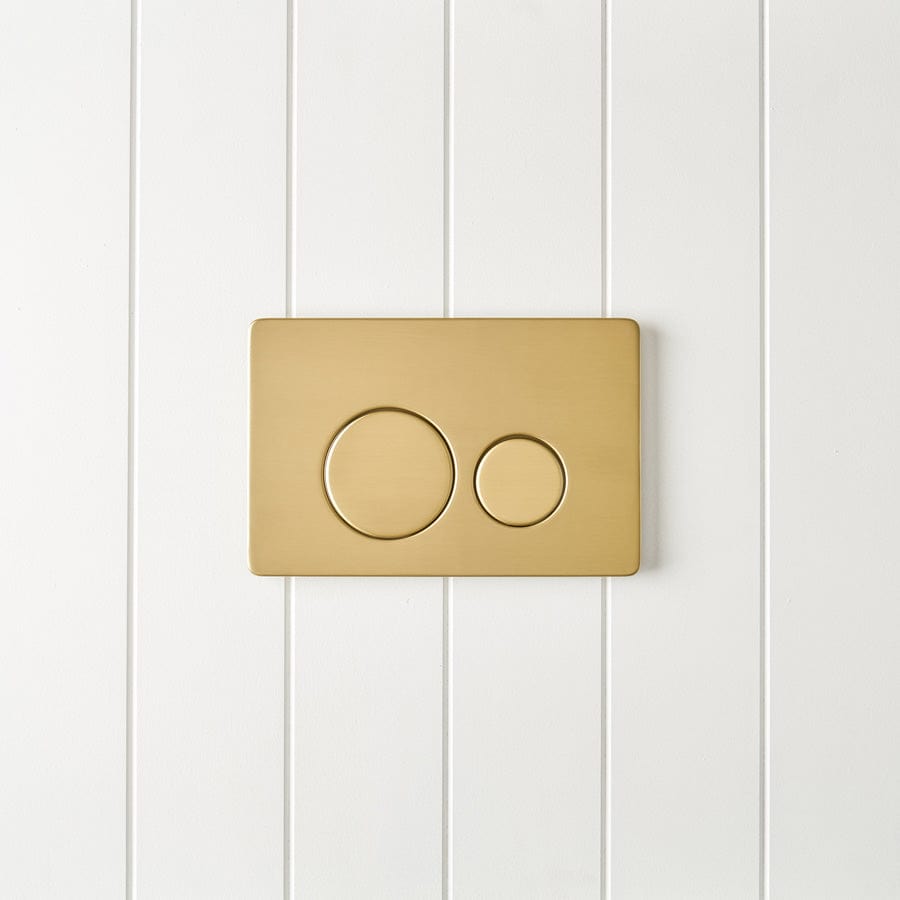 Elegant Curved In-Wall Toilet with Round Brushed Brass Buttons - Modern Space-Saving Bathroom Solution for Small Spaces & Luxury Homes