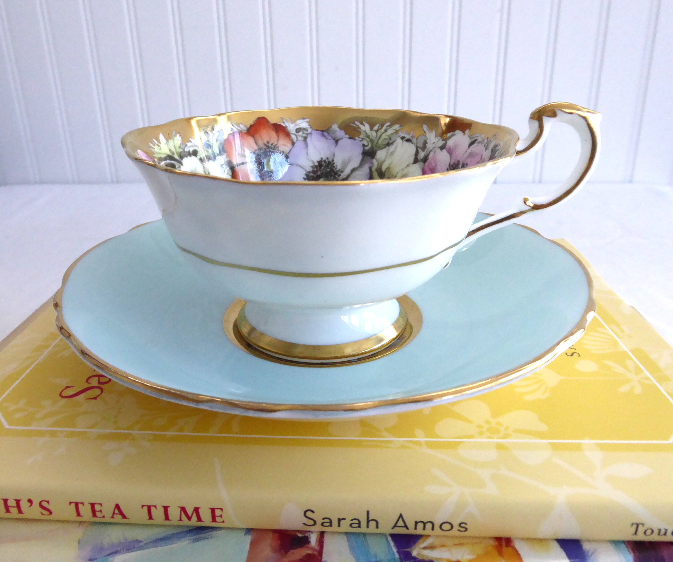 Vintage Paragon Cup and Saucer Set - Luxe Gold Trim with Aqua Poppies Design, Queen Elizabeth Warrant 1950s - Perfect for Afternoon Tea, Collectible China Display, and British Royalty Memorabilia