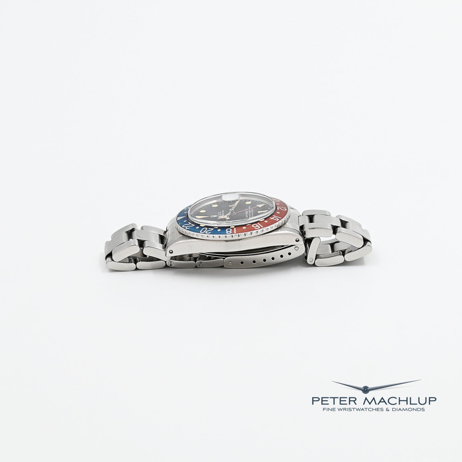 Vintage Rolex GMT-Master Pepsi 1675 Men's Watch - 1975 Model, Stainless Steel, Red & Blue Bezel - Perfect for Collectors & Travel Enthusiasts