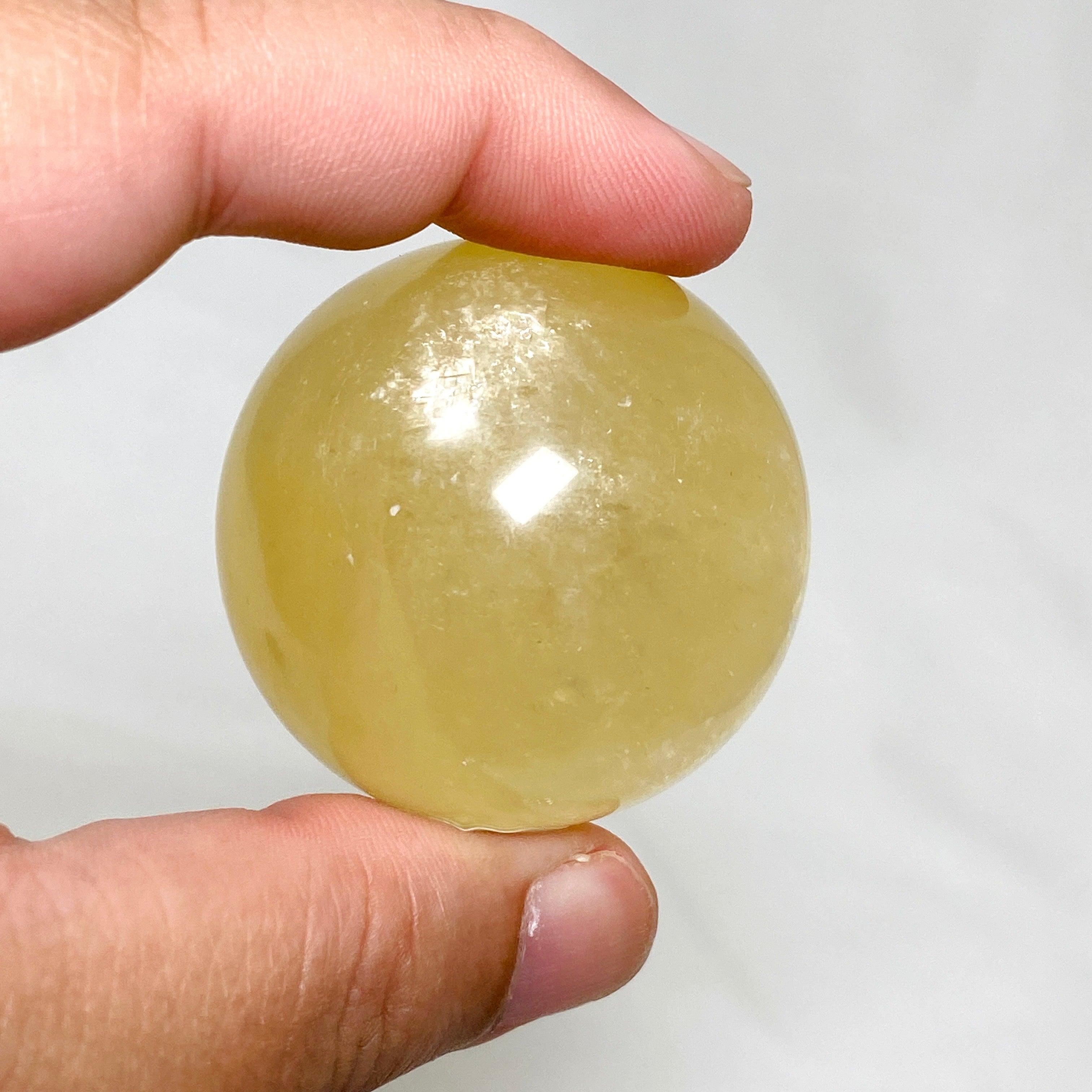Natural Honey Calcite Sphere - 120-130g - Healing Crystal for Meditation, Reiki, and Home Decor