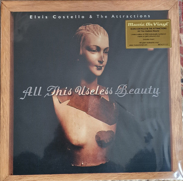 Elvis Costello & The Attractions - All This Useless Beauty Limited Edition Gold Vinyl LP Album (Numbered Reissue, Mint Condition) - Perfect for Record Collectors & Vintage Music Lovers