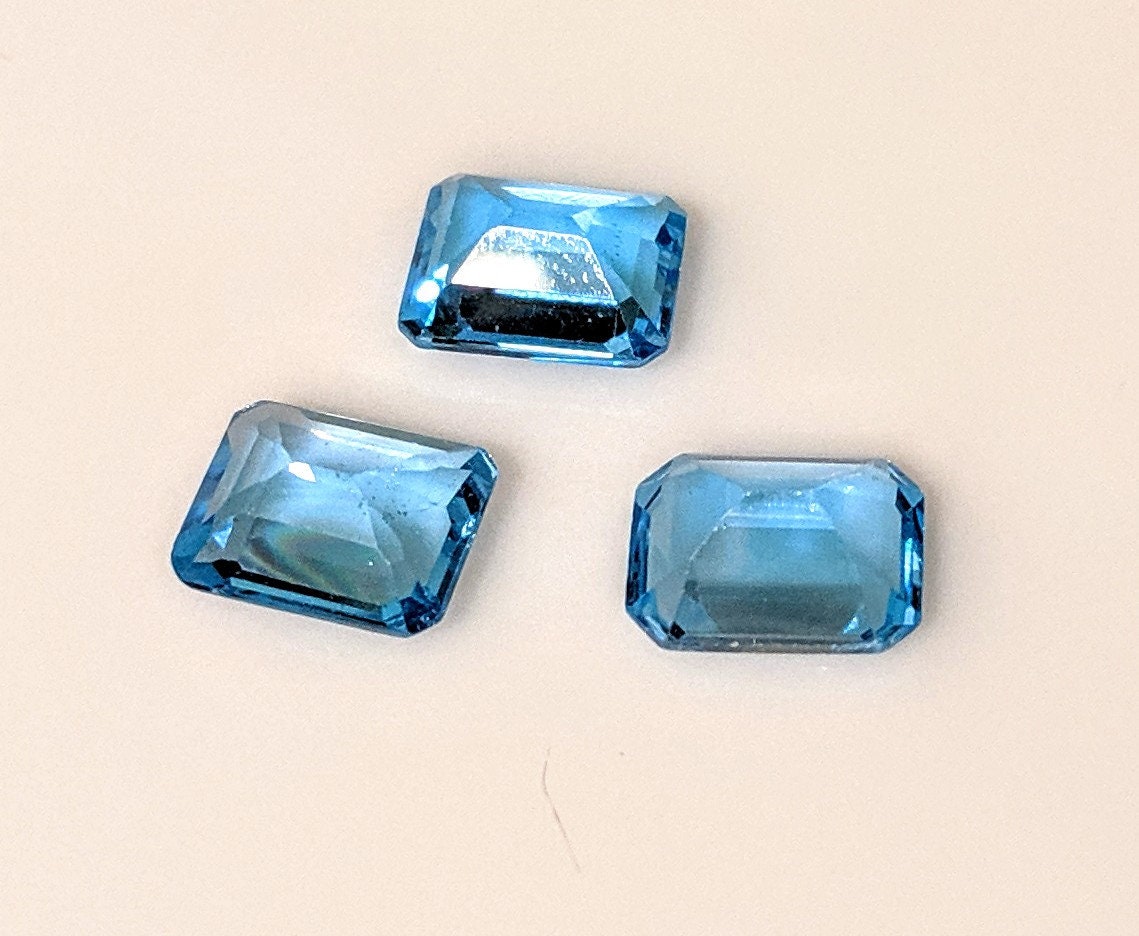 3-Piece Lot of Natural African Swiss Blue Topaz Loose Stones - 9x7mm Emerald Cut, 8.28ct Total Weight, VVS Eye Clean Quality for Jewelry Making, Engagement Rings & Custom Designs
