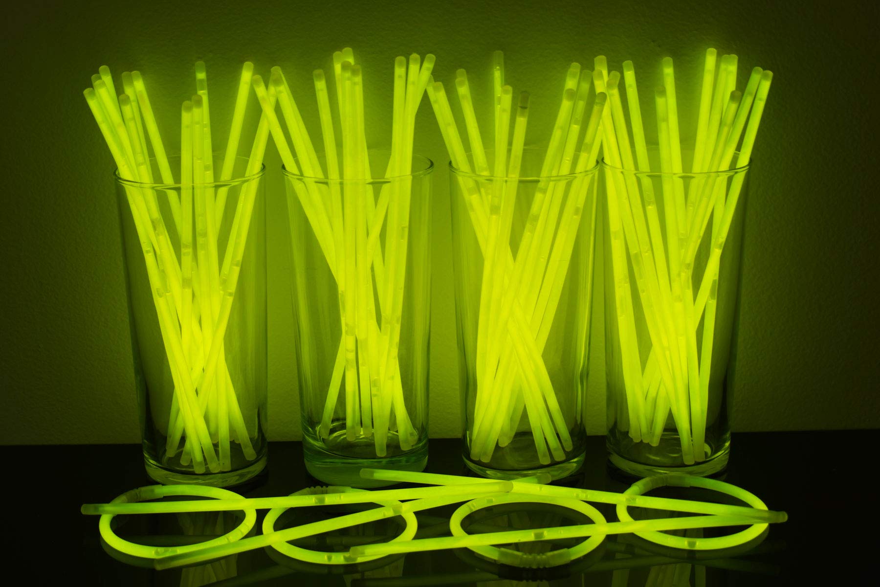 DirectGlow 8-Inch Premium Glow in The Dark Bracelets - 100 Pack Yellow Glow Sticks with Extra Strong Connectors for Parties, Raves, Concerts & Night Events
