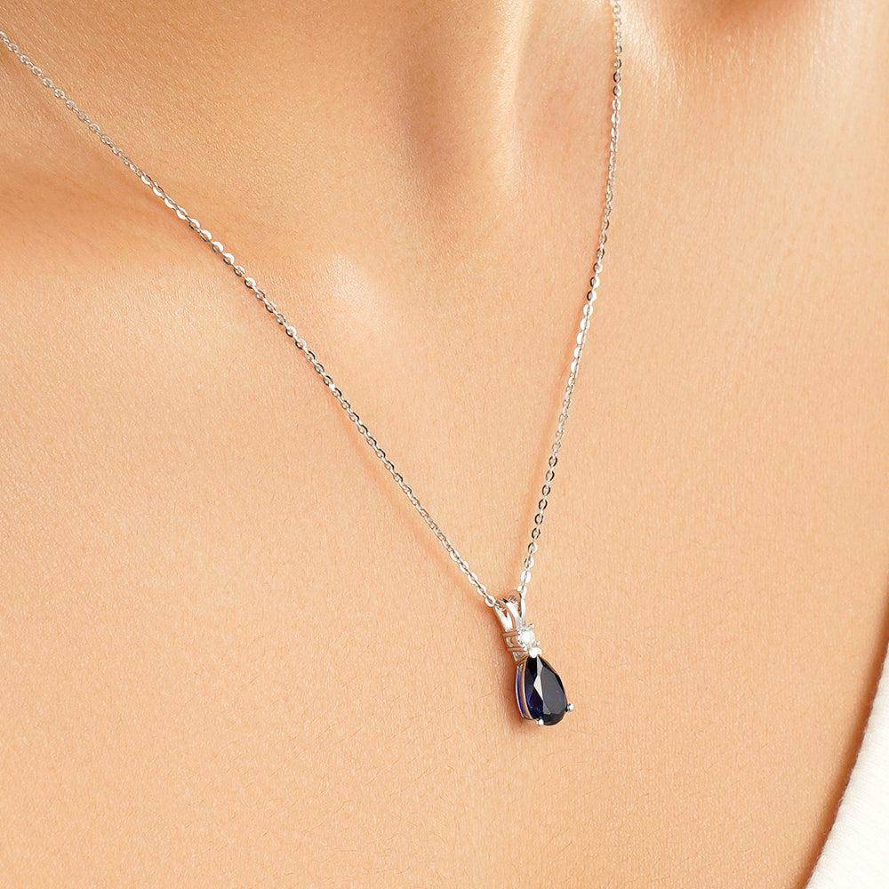1.7 Carat Pear Cut Blue Sapphire Solitaire Pendant with White Sapphire Accents - Elegant Jewelry for Weddings, Anniversaries & Special Occasions