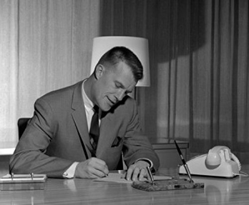 Businessman Writing at Desk Poster Print - 18 x 24 Inches - Motivational Office Wall Art for Home & Workplace Decor