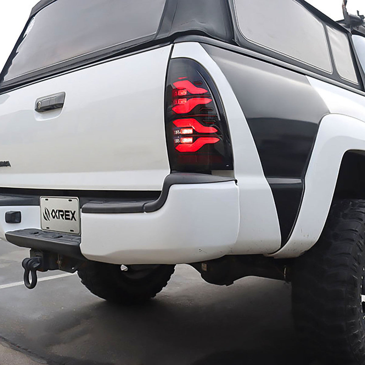 05-15 Toyota Tacoma LUXX Series LED Tail Lights - Black Smoke Lens - High Performance Brake Lights - Perfect for Off-Roading & Night Driving