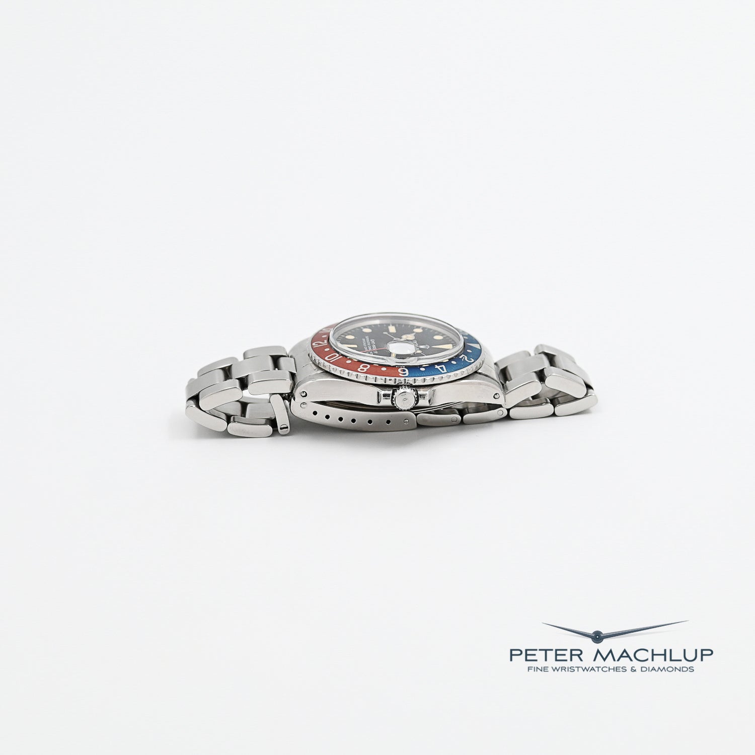 Vintage Rolex GMT-Master Pepsi 1675 Men's Watch - 1975 Model, Stainless Steel, Red & Blue Bezel - Perfect for Collectors & Travel Enthusiasts