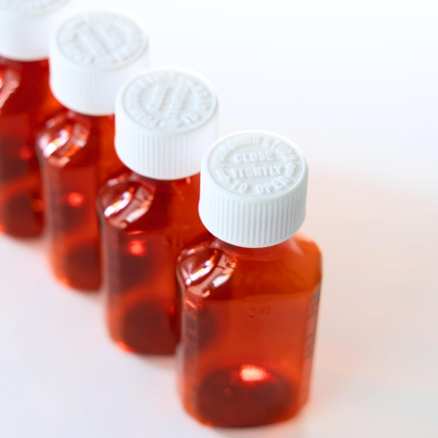 Child Resistant 2oz Empty Plastic Amber Medicine Bottles - Case of 100 Oval Prescription Dispensing Bottles with Safety Lids for Light-Sensitive Pharmacy Storage | Perfect for Home Medication Organization & Professional Pharmacy Use
