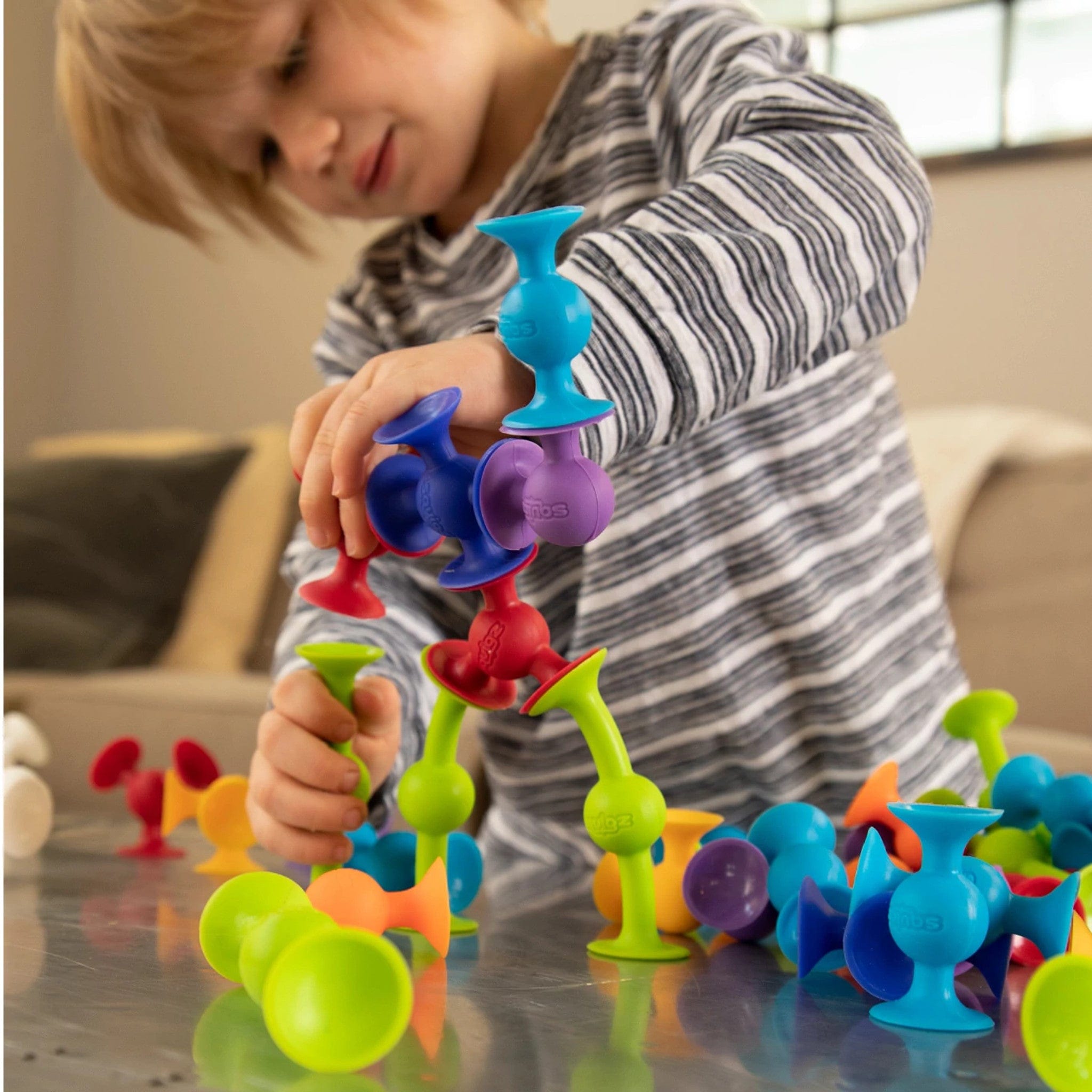 Fat Brain Toys Squigz Deluxe Set - 100-Piece Creative Building Toy for Kids, STEM Learning & Sensory Play - Perfect for Home, Classroom & Travel Activities