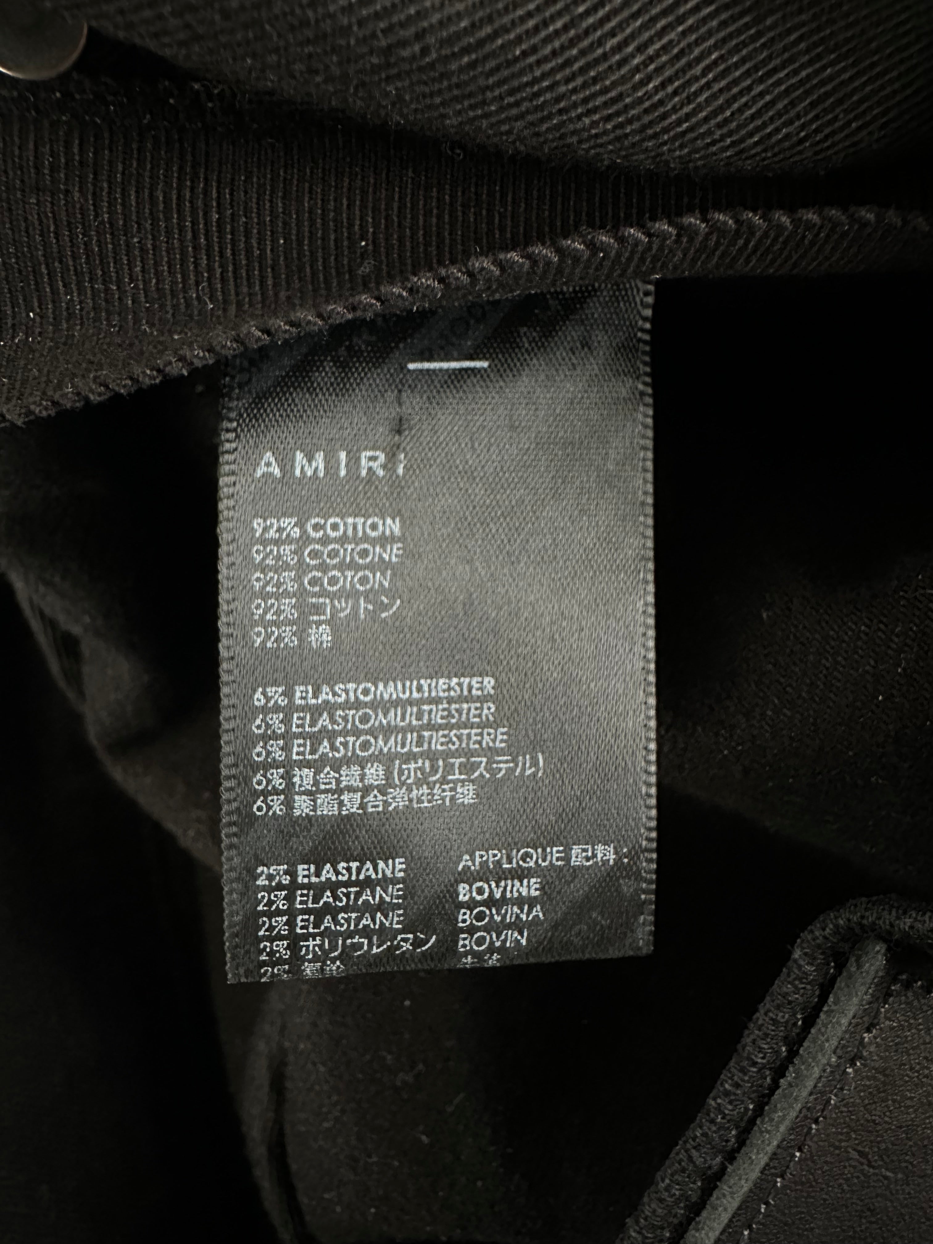 Amiri Black Leather Patch Thrasher Jeans for Men - Premium Distressed Denim Pants with Signature Leather Detail | Perfect for Streetwear, Casual Outfits & Night Out Looks