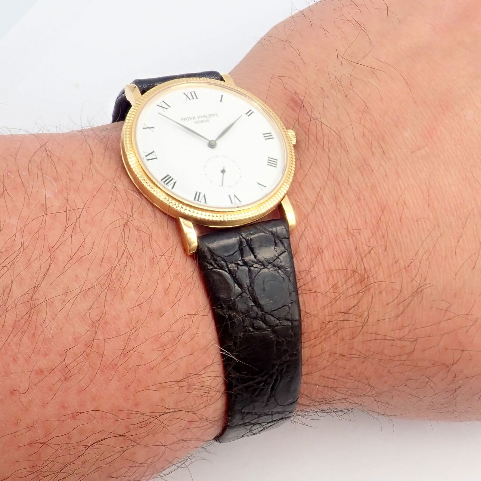 Patek Philippe Calatrava 18k Yellow Gold Men's Watch with Roman Dial - Manual Wind Luxury Dress Watch for Formal Events & Business Occasions