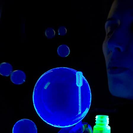 Tekno Bubbles - Gold UV Blacklight Reactive Bubble Solution - 64oz (Half Gallon) for Parties, Events & Glow in the Dark Fun
