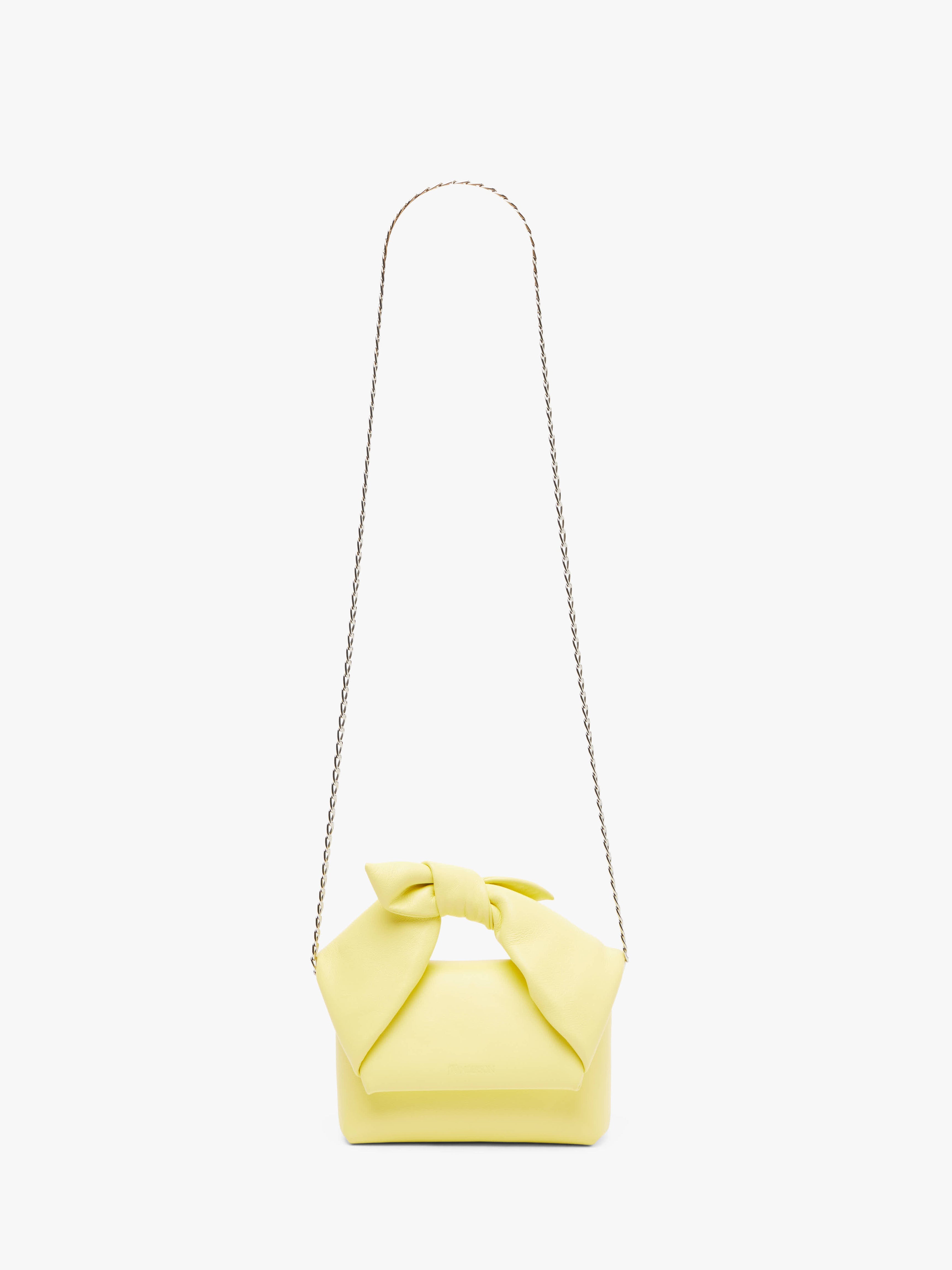 SMALL BOW TWISTER LEATHER TOP HANDLE BAG - Elegant Women's Handbag for Work, Party & Everyday Use
