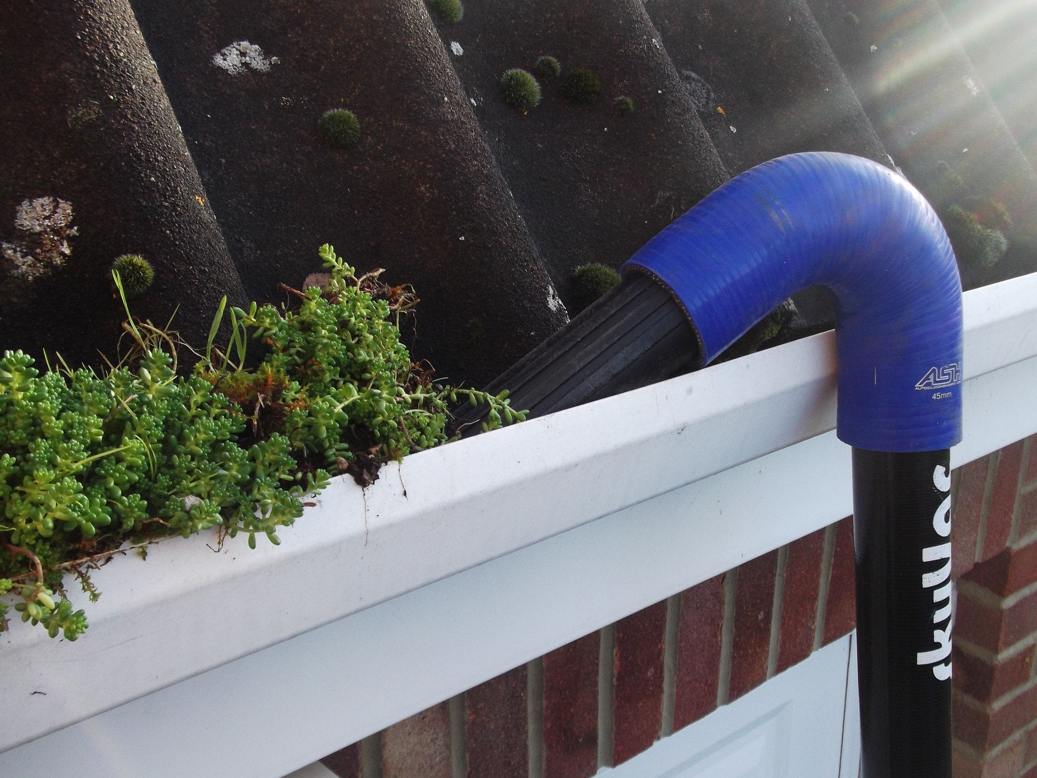 SkyVac®️ Gutter Cleaning Action Photo - Close Up View for Home Maintenance & Roof Care | Perfect for Gutter Cleaning Services & DIY Projects