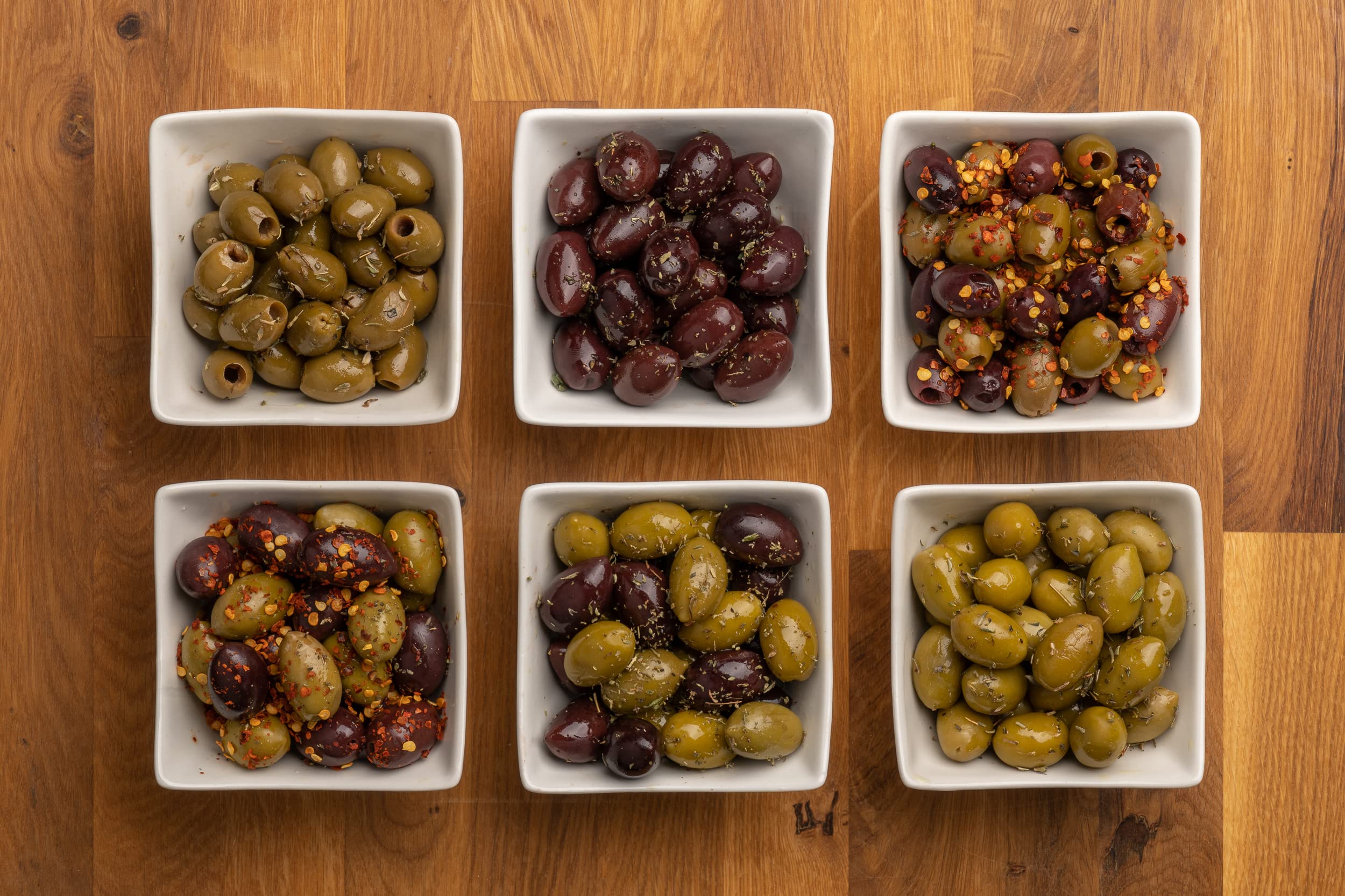 Pack of 4 Premium Greek Olives in Vacuum Seal - Kalamata & Halkidiki Varieties with 4 Flavors in Extra Virgin Olive Oil (4X200g) - Perfect for Charcuterie Boards, Salads & Mediterranean Cooking