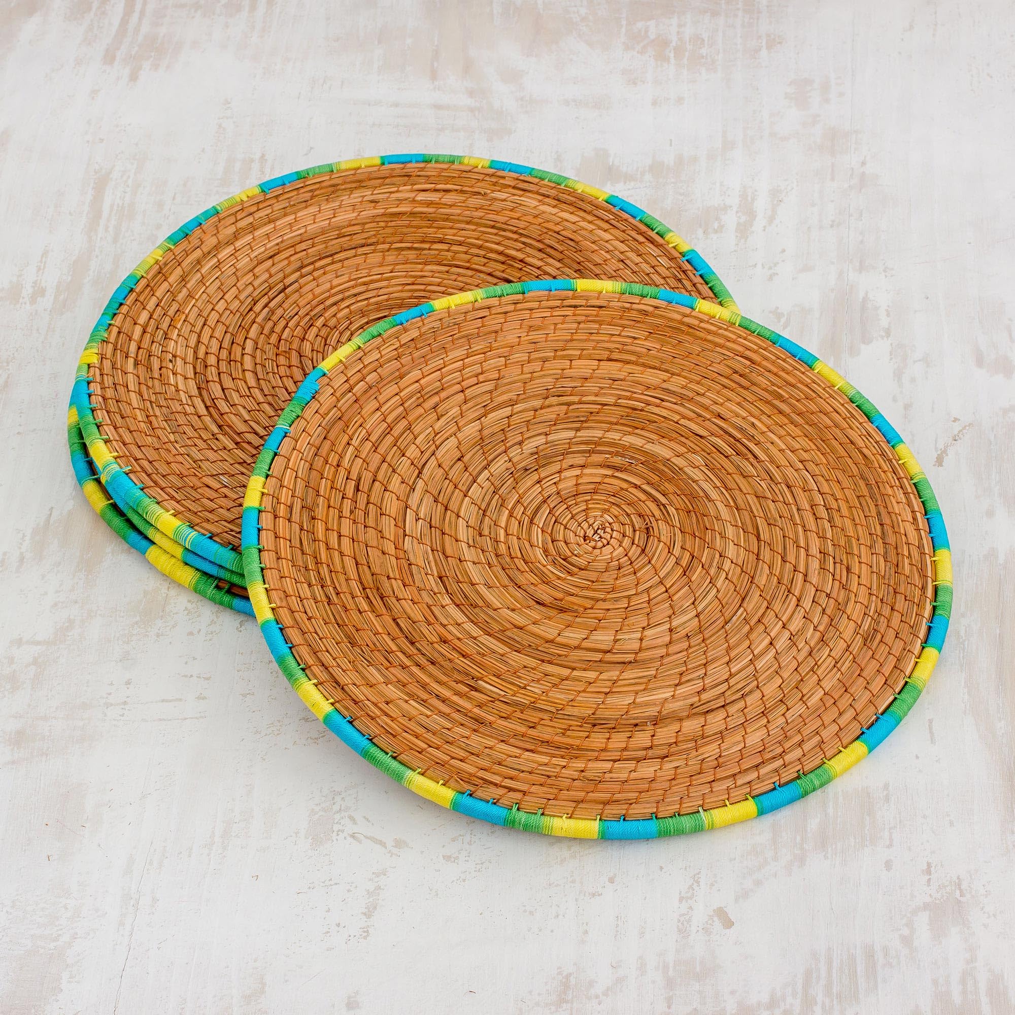 NOVICA Handwoven Pine Needle Placemats Set of 4 - Guatemalan Artisan Crafted with Blue, Green & Yellow Trim - 12.5