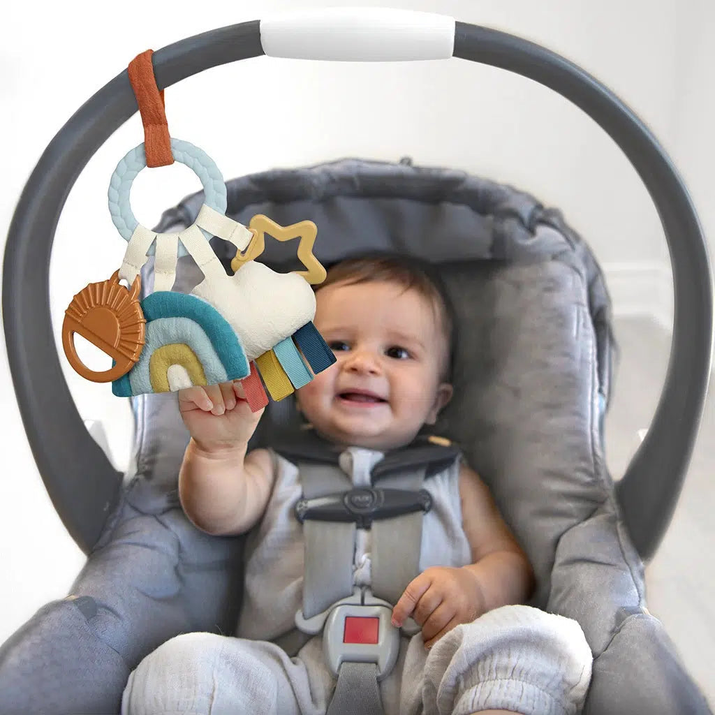 Itzy Ritzy Bitzy Busy Ring Teething Activity Toy - Soft Silicone Teether for Babies, Sensory & Chewing Toy for Infants, Perfect for Soothing Sore Gums & Developmental Play | Cloud Design
