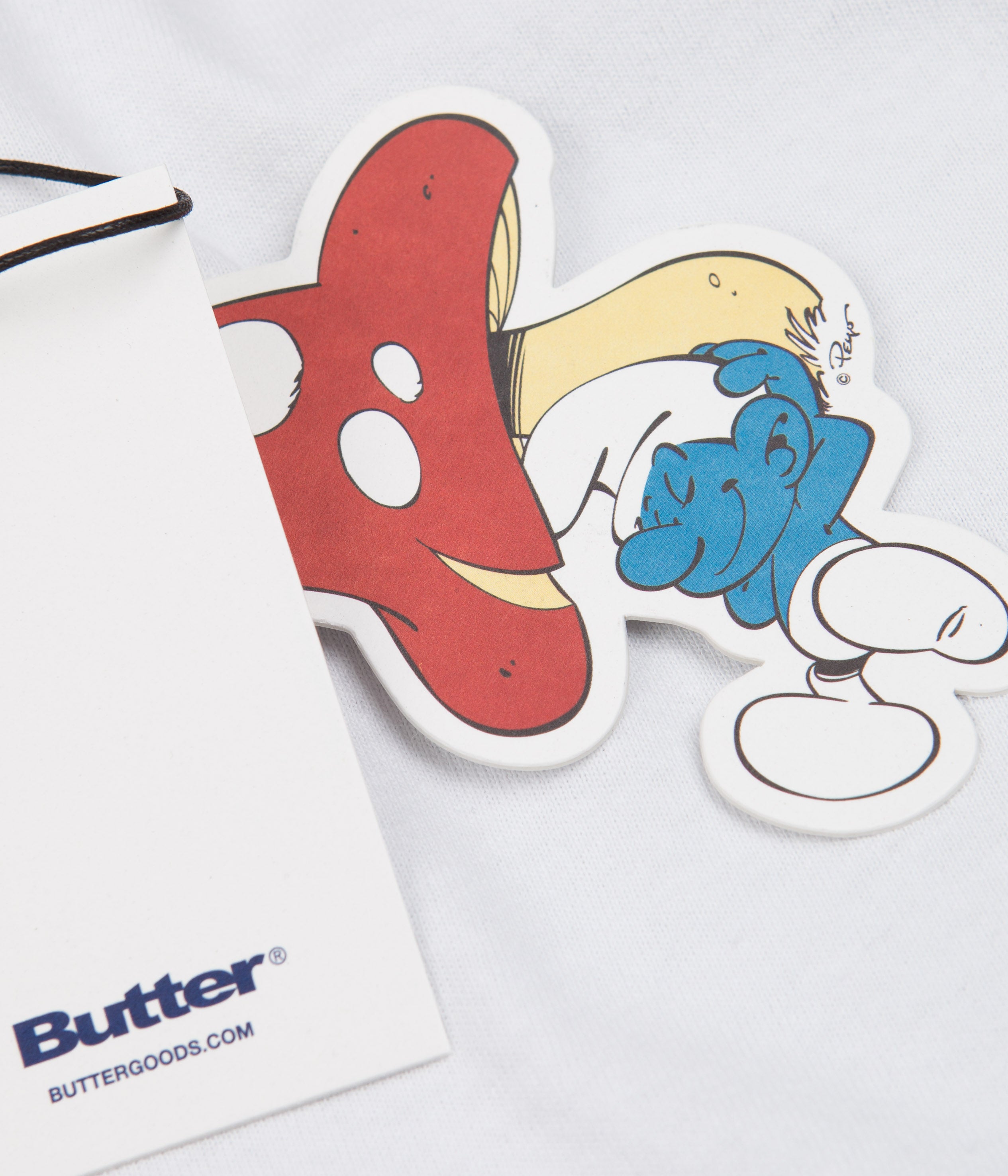 Butter Goods x The Smurfs Lazy Logo T-Shirt - White Cotton Graphic Tee for Casual Wear & Street Style Outfits