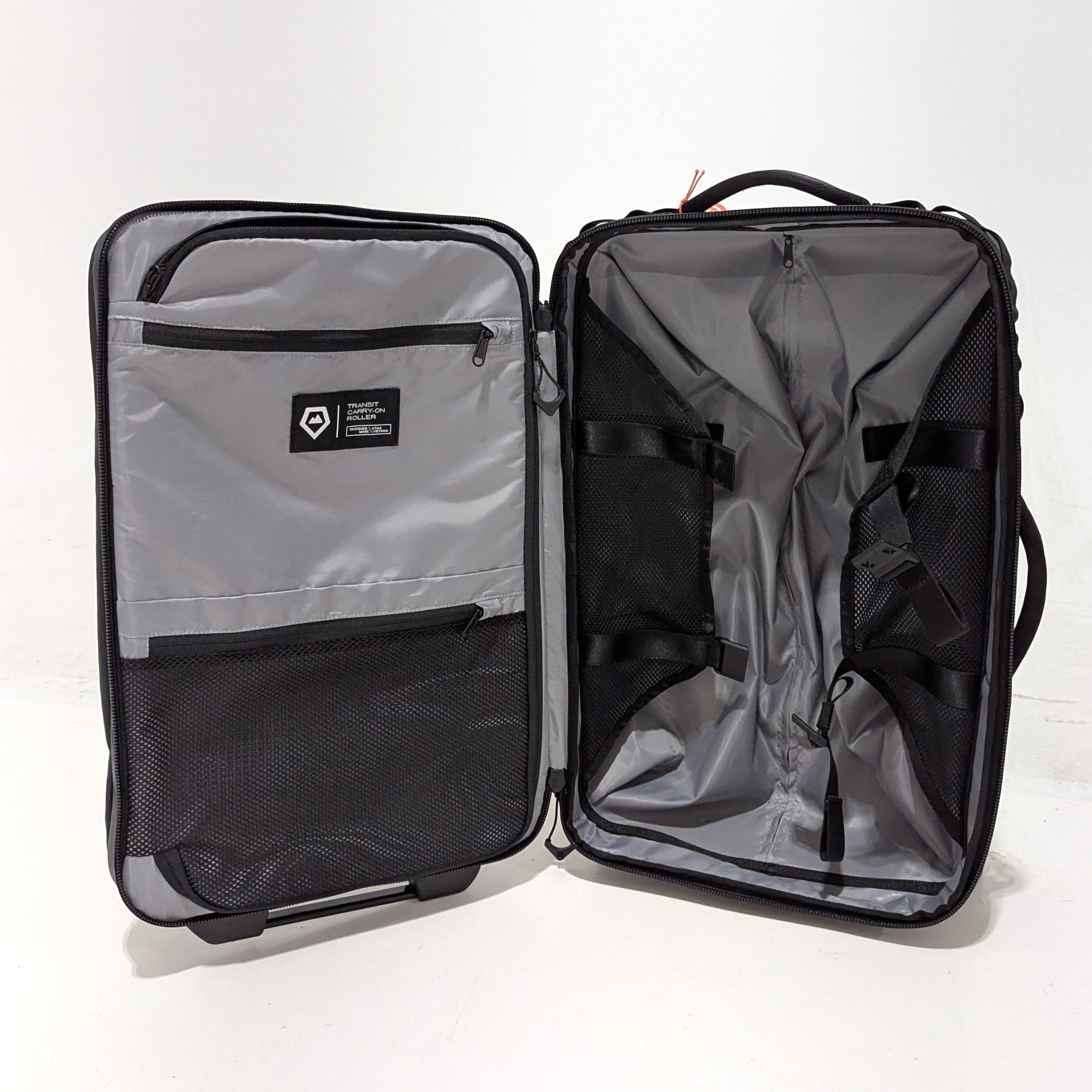 WANDRD Transit Carry On Roller Bag 40L - Black | Premium Used Luggage for Travel & Business Trips | Durable Spinner Suitcase with Smooth Wheels