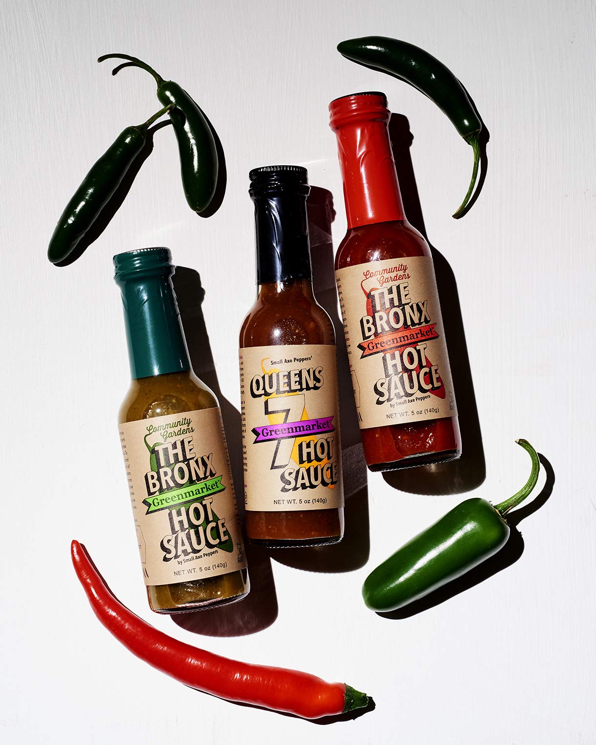 Small Axe Peppers NYC Hot Sauce Set - 3 Pack (5 oz Each) | All Natural, Non-GMO, Community Garden Grown | Gourmet Hot Sauce with Queens 7, Bronx Red & Bronx Greenmarket Serrano Pepper | Featured on HOT ONES | Perfect for Wings, Tacos, Burgers & Gifting