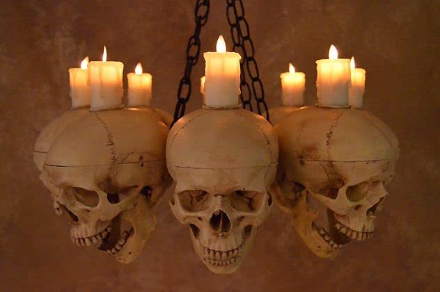 Gothic Skull & Metal Chandelier with 8 Life-Size Skulls - Black Iron Frame & Flameless LED Candles for Halloween Decor, Haunted House, Gothic Home, or Dark Themed Parties