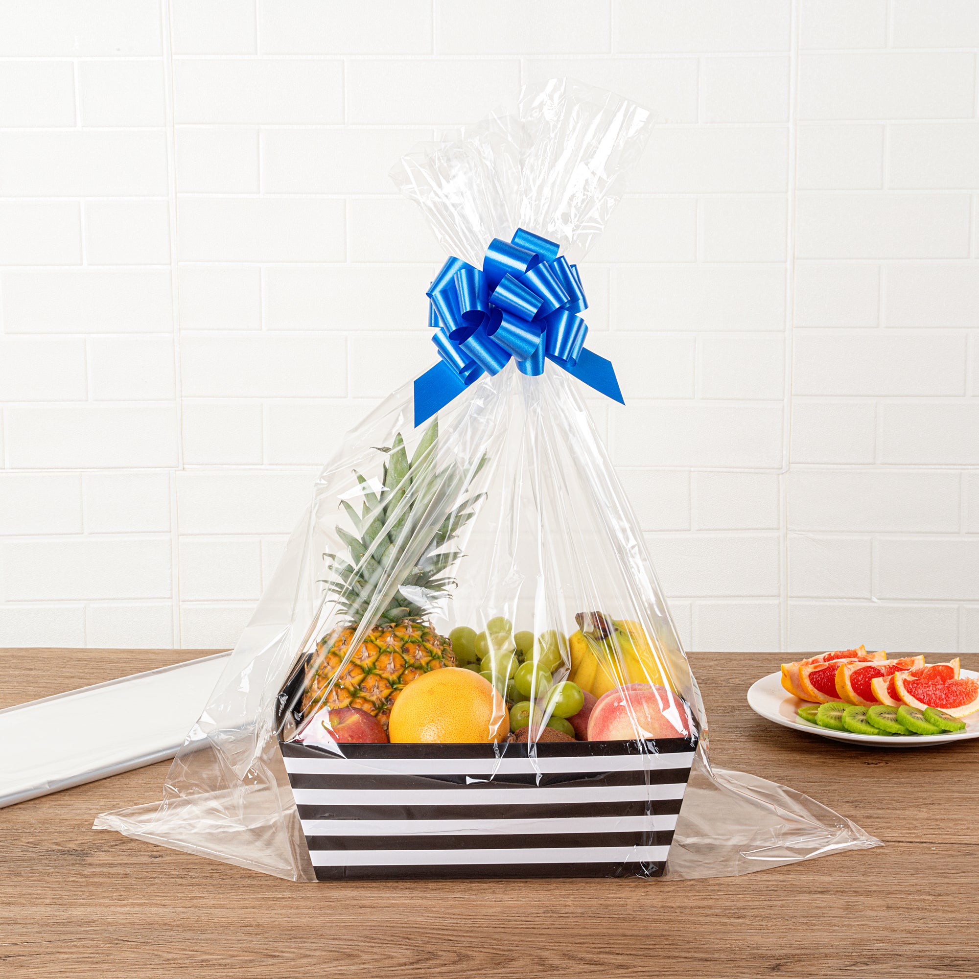 Clear Plastic Gift Basket Wrap Sheets - 25 x 30 Inches, 100 Count Box - Perfect for Party Favors, Wedding Decorations & Holiday Gift Wrapping