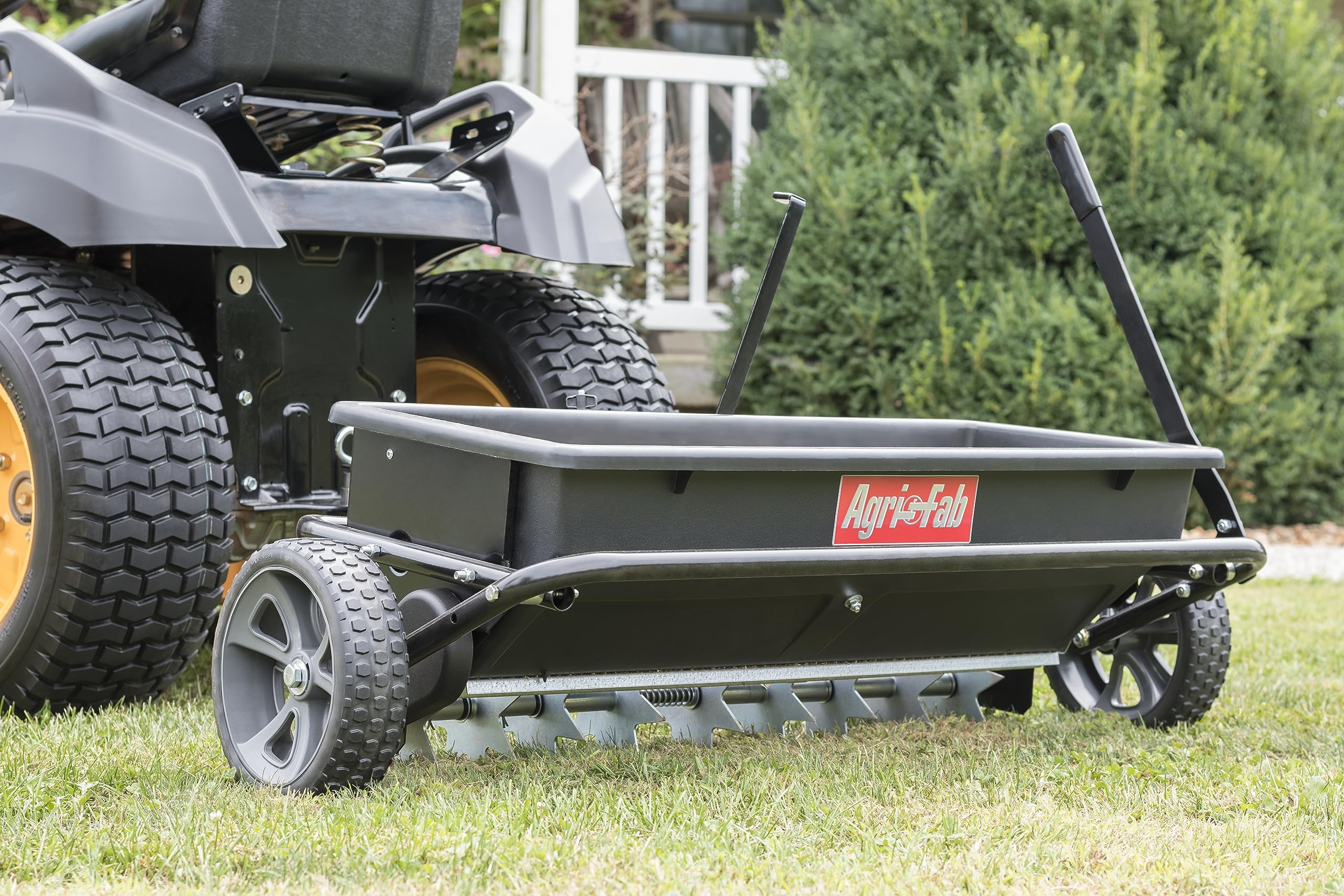 Agri-Fab 45-0543-AMZ 100 lb. Tow-Behind Lawn Spiker Seeder Drop Spreader - for Seed, Fertilizer, Salt & Ice Melt - Compatible with Lawn & Garden Tractors - Perfect for Lawn Care, Yard Maintenance & Winter De-Icing