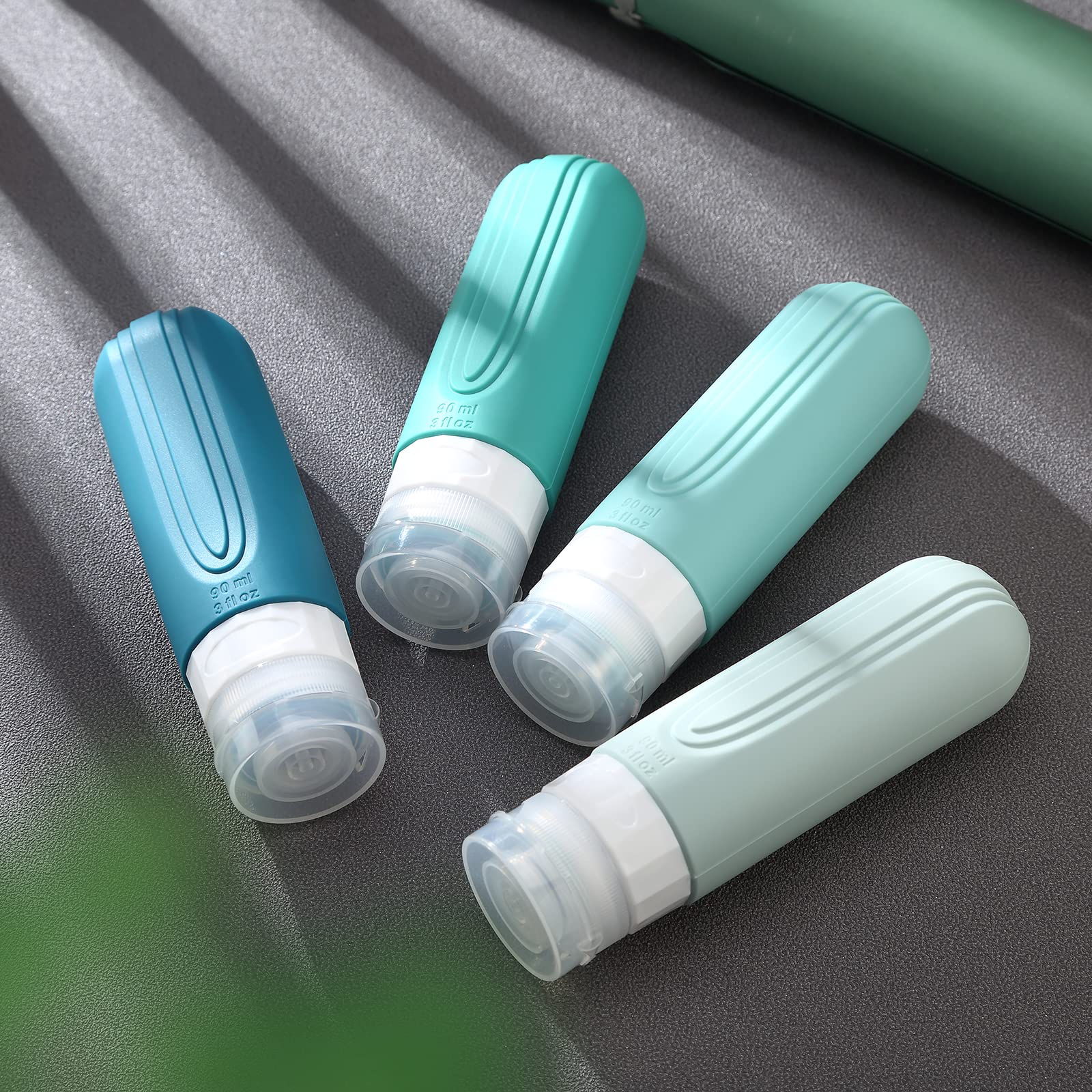 TSA Approved 3oz Travel Bottles (4 Pack) - BPA Free Leak Proof Silicone Containers for Shampoo, Conditioner & Lotion | Refillable Squeezable Toiletry Bottles for Airplane Travel, Gym & Vacation Essentials