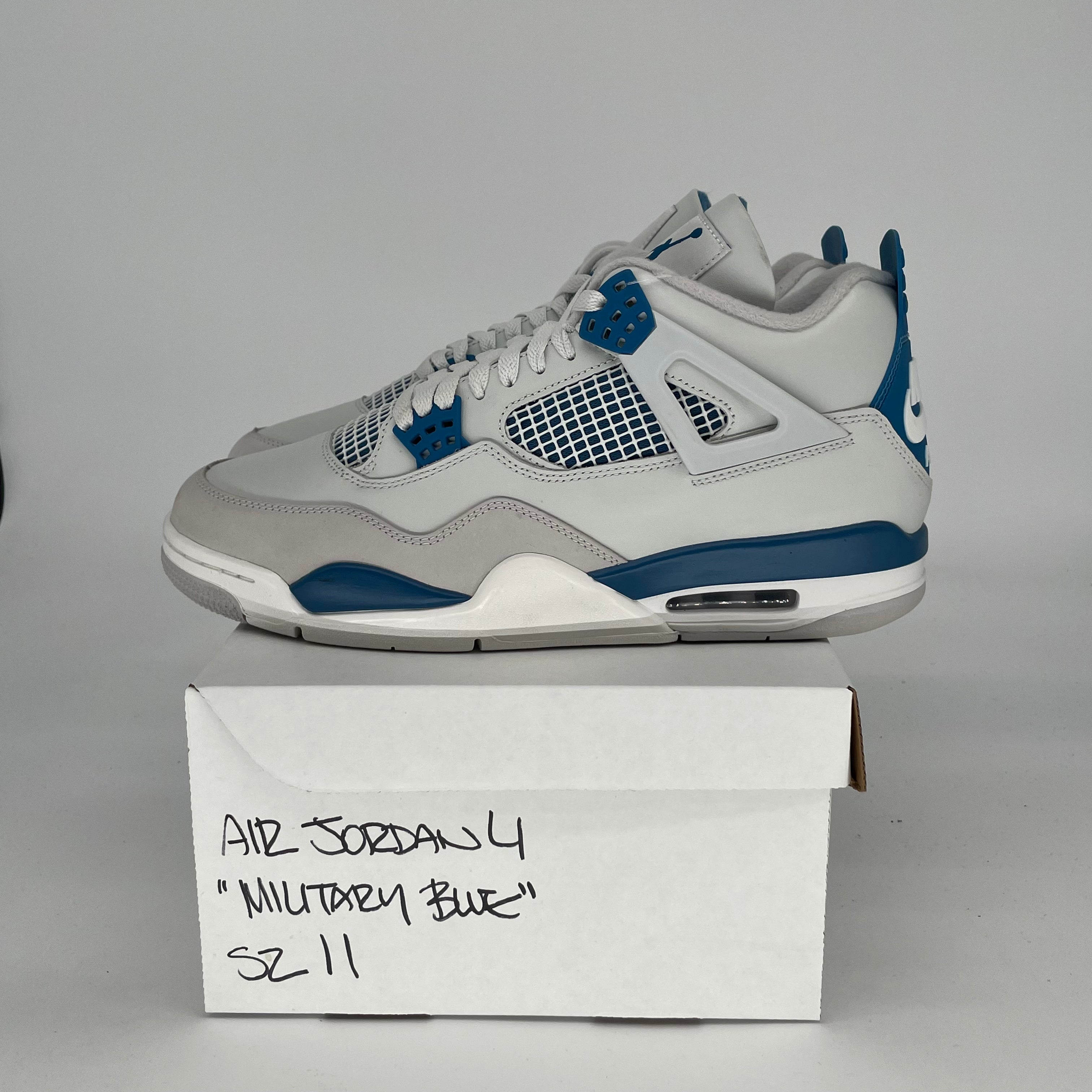 Original Title: AIR JORDAN 4 MILITARY BLUE SIZE 11/12.5W FV5029 141   Optimized Title: **Air Jordan 4 Retro Military Blue Men's/Women's Shoes Size 11 & 12.5W - Style Code FV5029-141 - Perfect for Sneaker Collectors & Casual Wear**    (Note: I corrected 