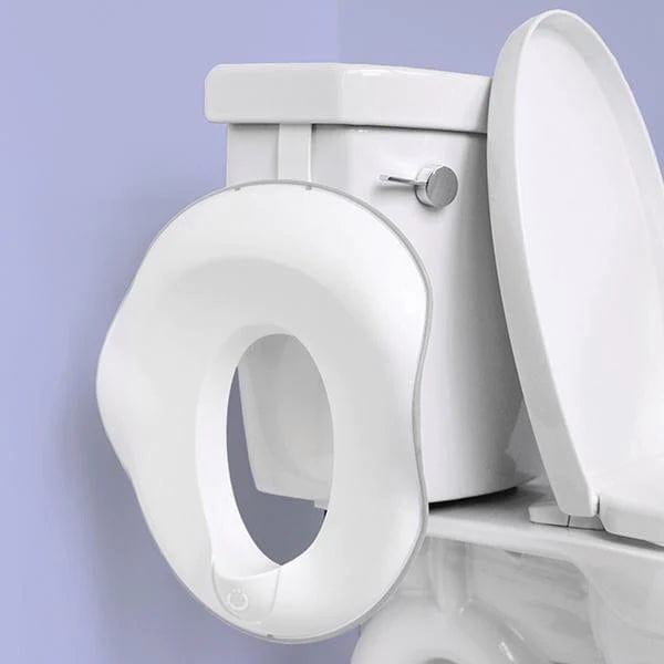 Ubbi Toilet Trainer for Toddlers - Potty Training Seat with Anti-Slip Design for Boys & Girls - Easy to Clean & Portable for Home & Travel Use