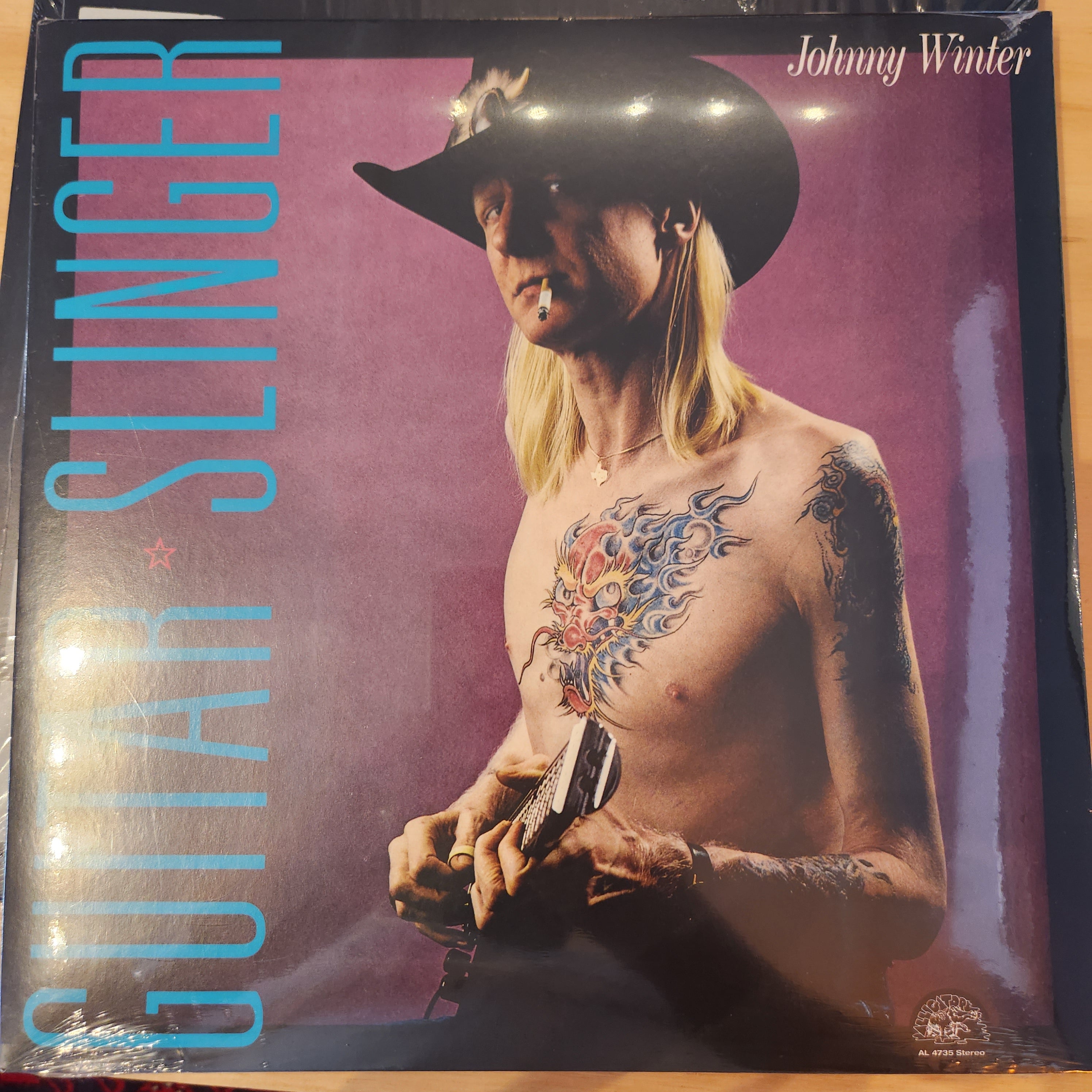 Johnny Winter Guitar Slinger Vinyl LP Record - Classic Blues Rock Music for Collectors & Audiophiles - Perfect for Home Listening & Music Enthusiasts