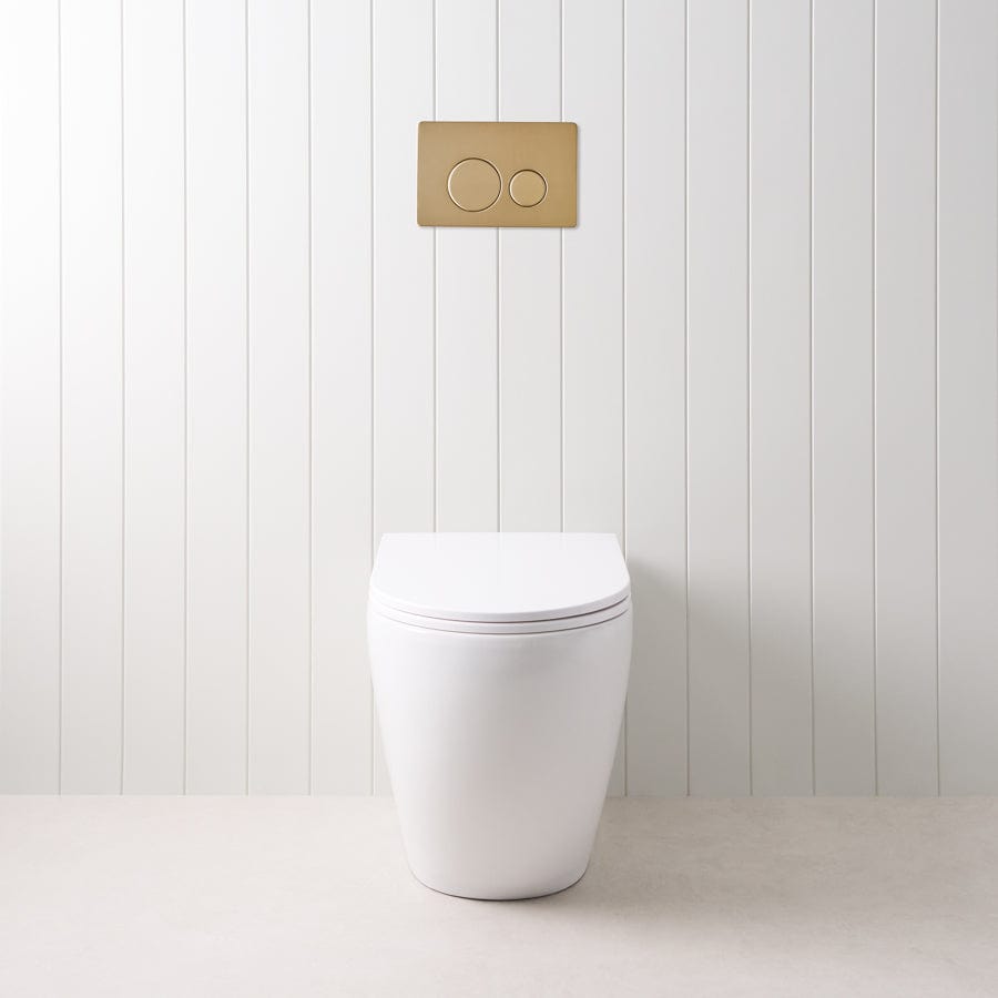 Curved In-Wall Toilet with Round Warm Brushed Nickel Buttons - Modern Space-Saving Bathroom Solution for Small Homes & Luxury Apartments