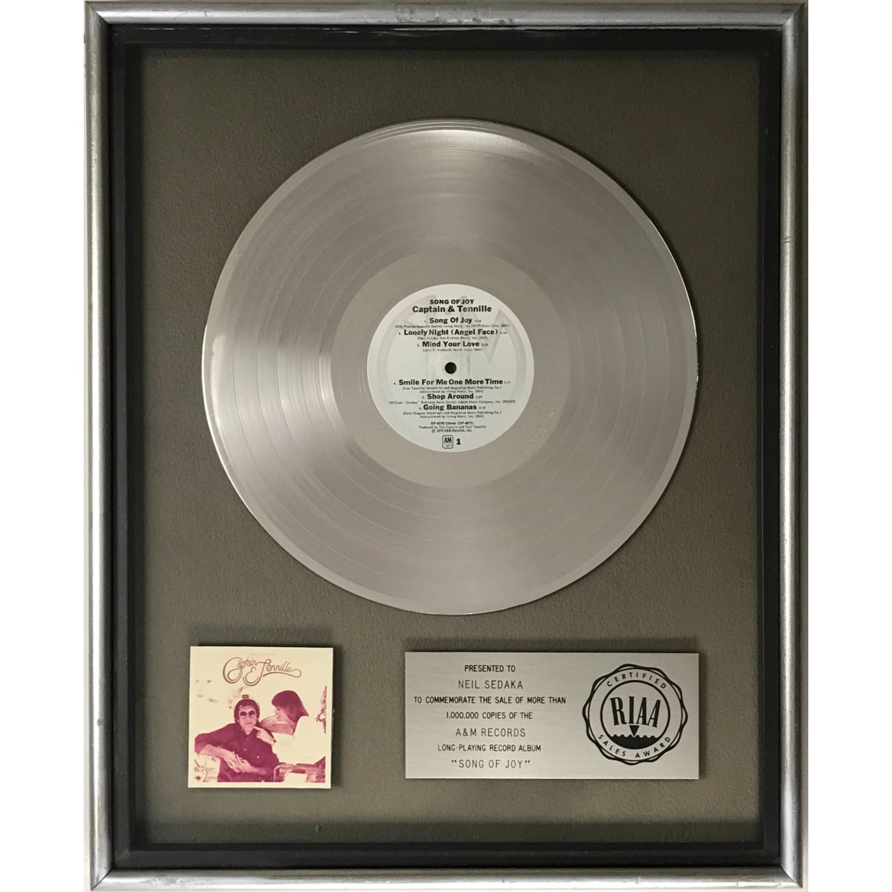 Captain & Tennille Song Of Joy RIAA Platinum LP Award Presented to Neil Sedaka - Rare Collectible Vinyl Record for Music Enthusiasts & Memorabilia Collectors - Perfect for Display in Home, Office, or Music Studio