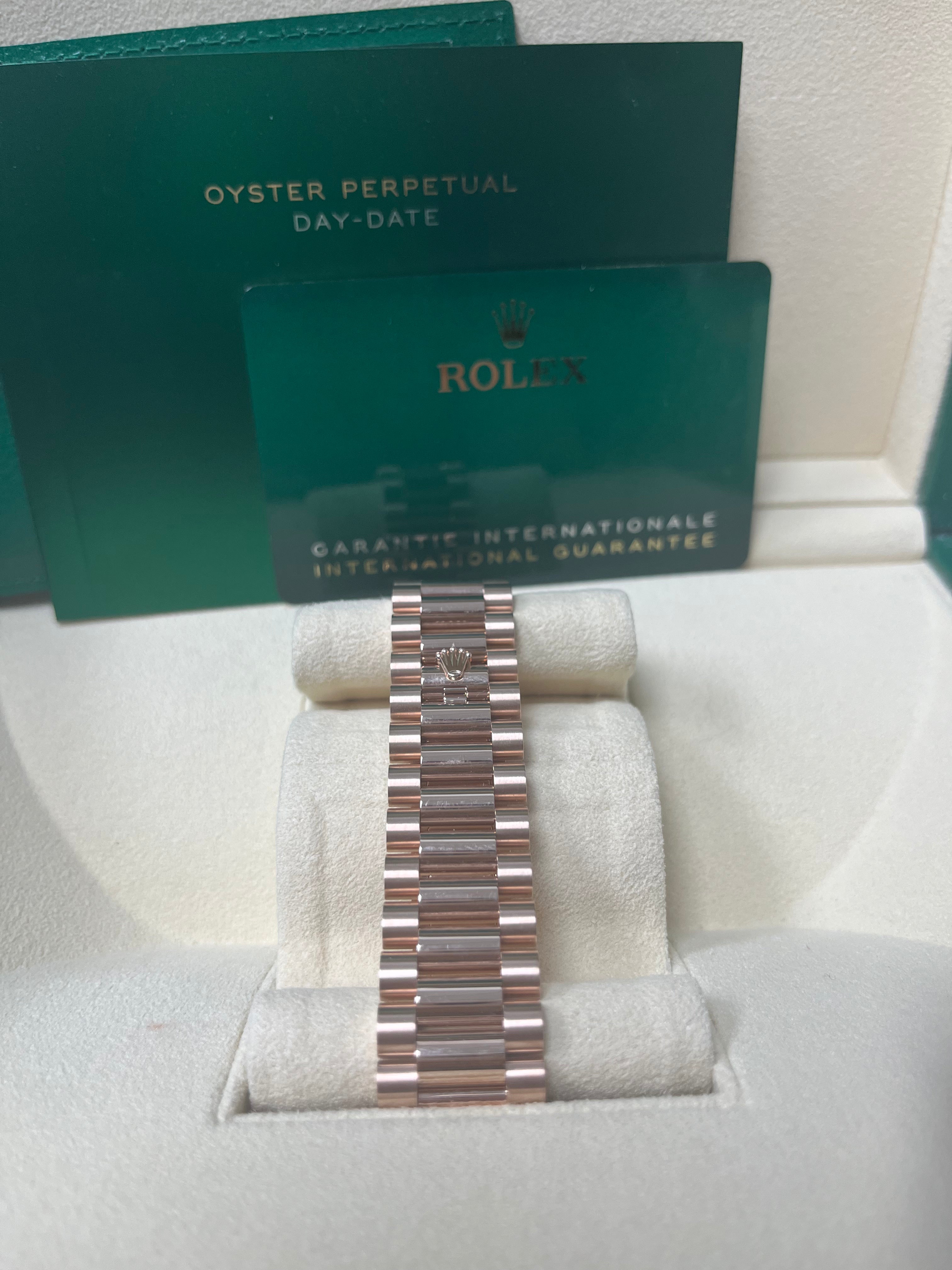 Rolex Day Date 40mm Rose Gold Watch with Sundust Roman Dial & Fluted Bezel (Ref #228235) - Luxury Dress Watch for Business & Formal Occasions