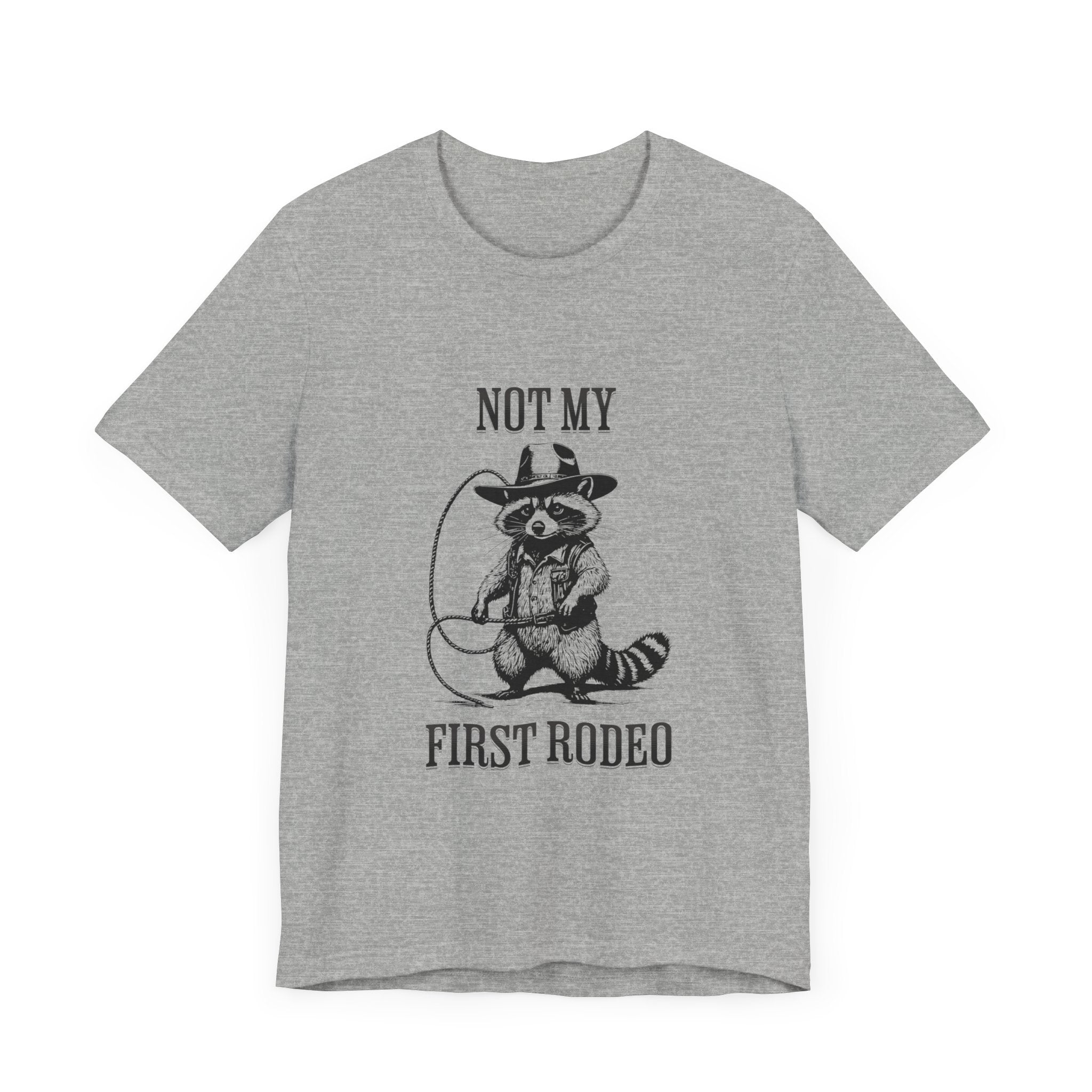 Funny Western Graphic Cotton Tee - Not My First Rodeo Cowboy Raccoon Shirt | Cute Quirky Country Style T-Shirt for Rodeo Fans & Animal Lovers | Perfect for Rodeo Events, Country Concerts & Casual Wear