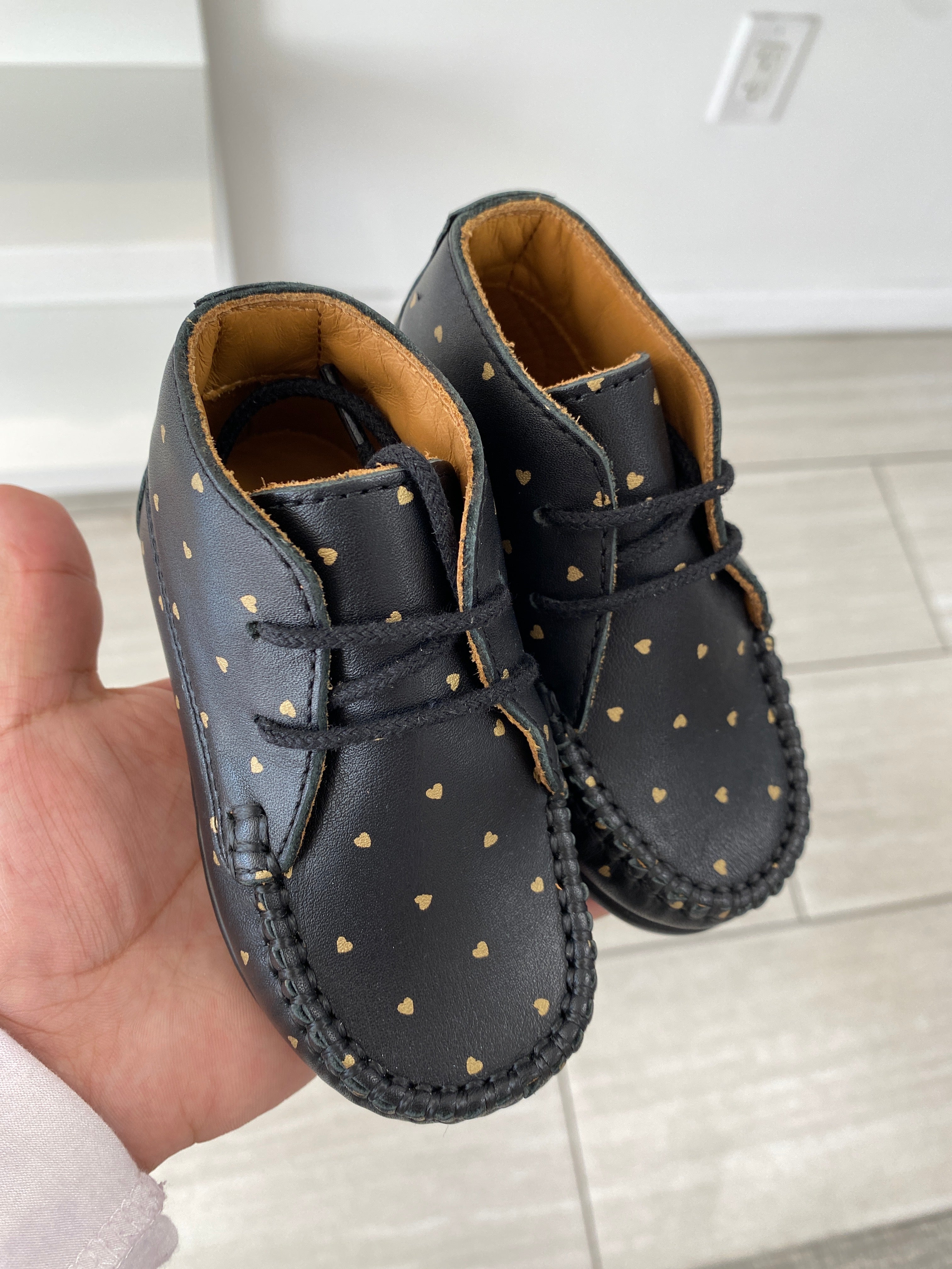 Porte Black and Gold Heart Baby Booties - Soft & Stylish First Walkers for Newborns - Perfect for Photo Shoots, Baby Showers, and Special Occasions