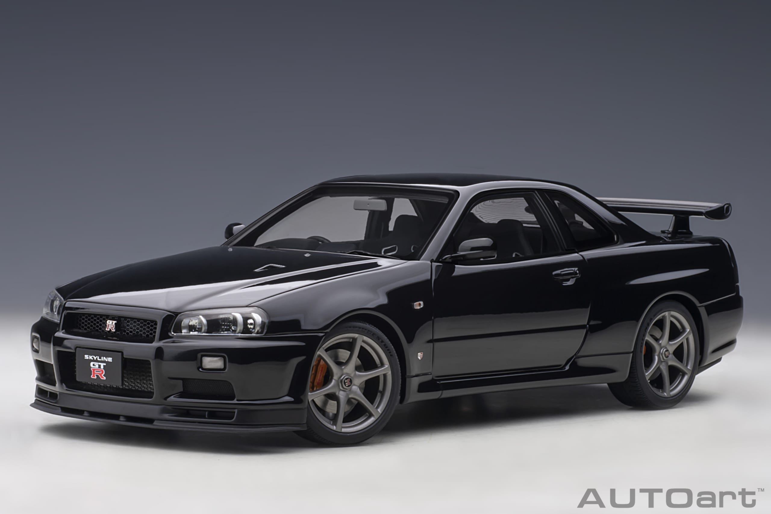 AUTOart 1:18 Scale Nissan Skyline GT-R R34 V-Spec II Diecast Model Car - Black Pearl Finish | Collectible Display for Car Enthusiasts & Perfect Gift for Racing Fans