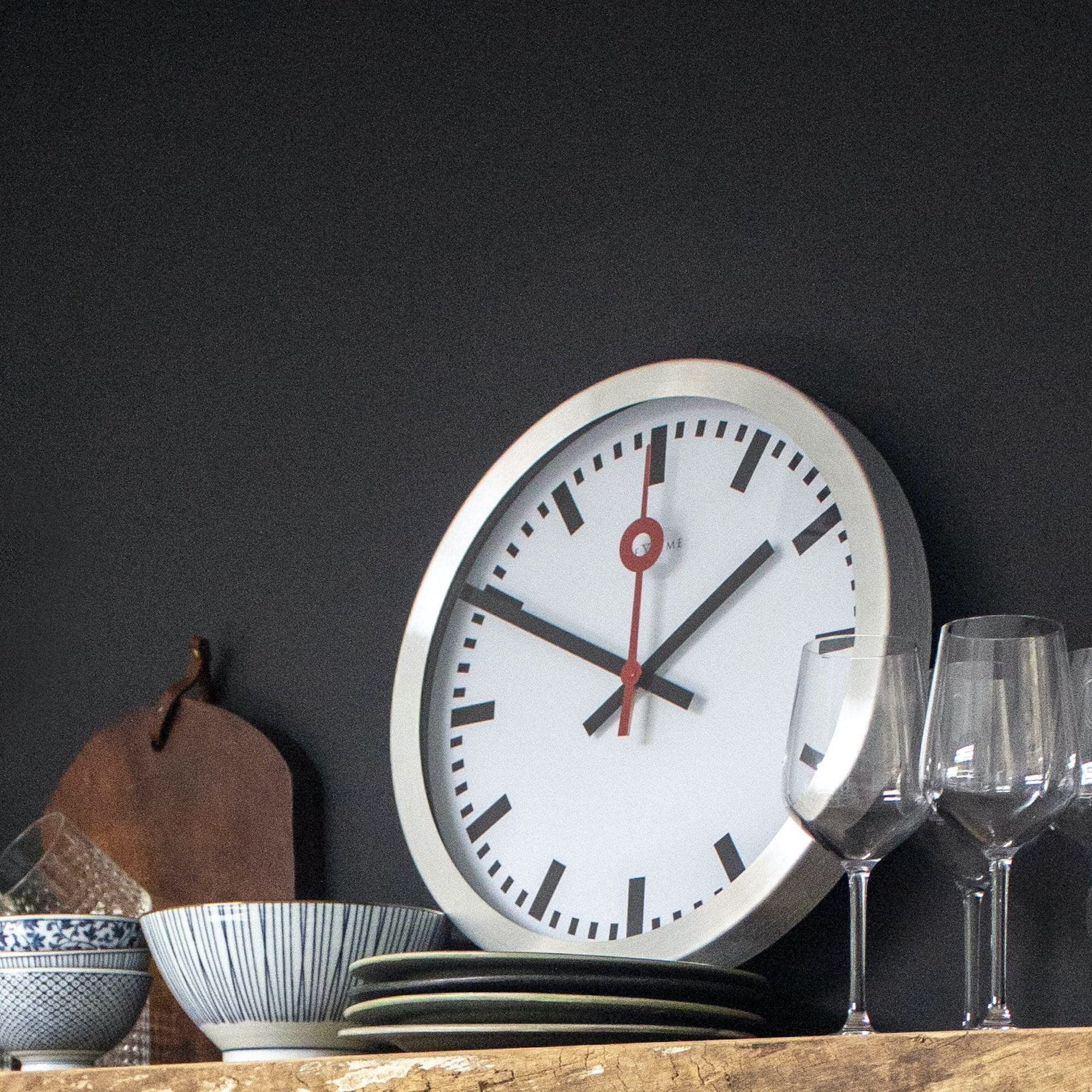 Nextime Unek Goods Station Wall Clock - Round White Face Battery Operated Wall Clock for Home, Office & Classroom Decor