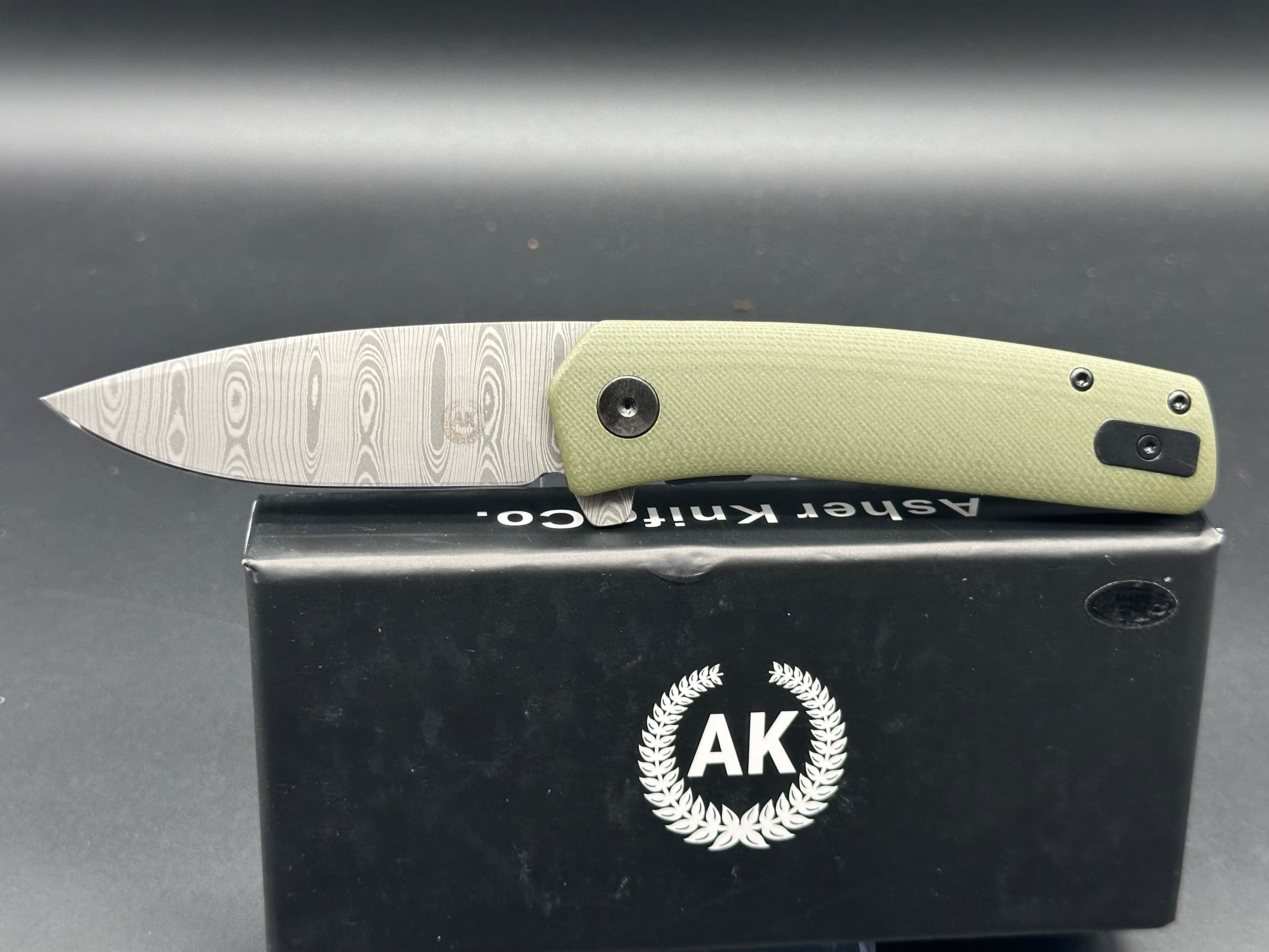 Asher Knives The Spiro Flipper Folding Pocket Knife - OD Green G10 Handle, S35VN Steel Blade, Laser Ladder Damascus Pattern - EDC, Outdoor, Camping, Survival Gear