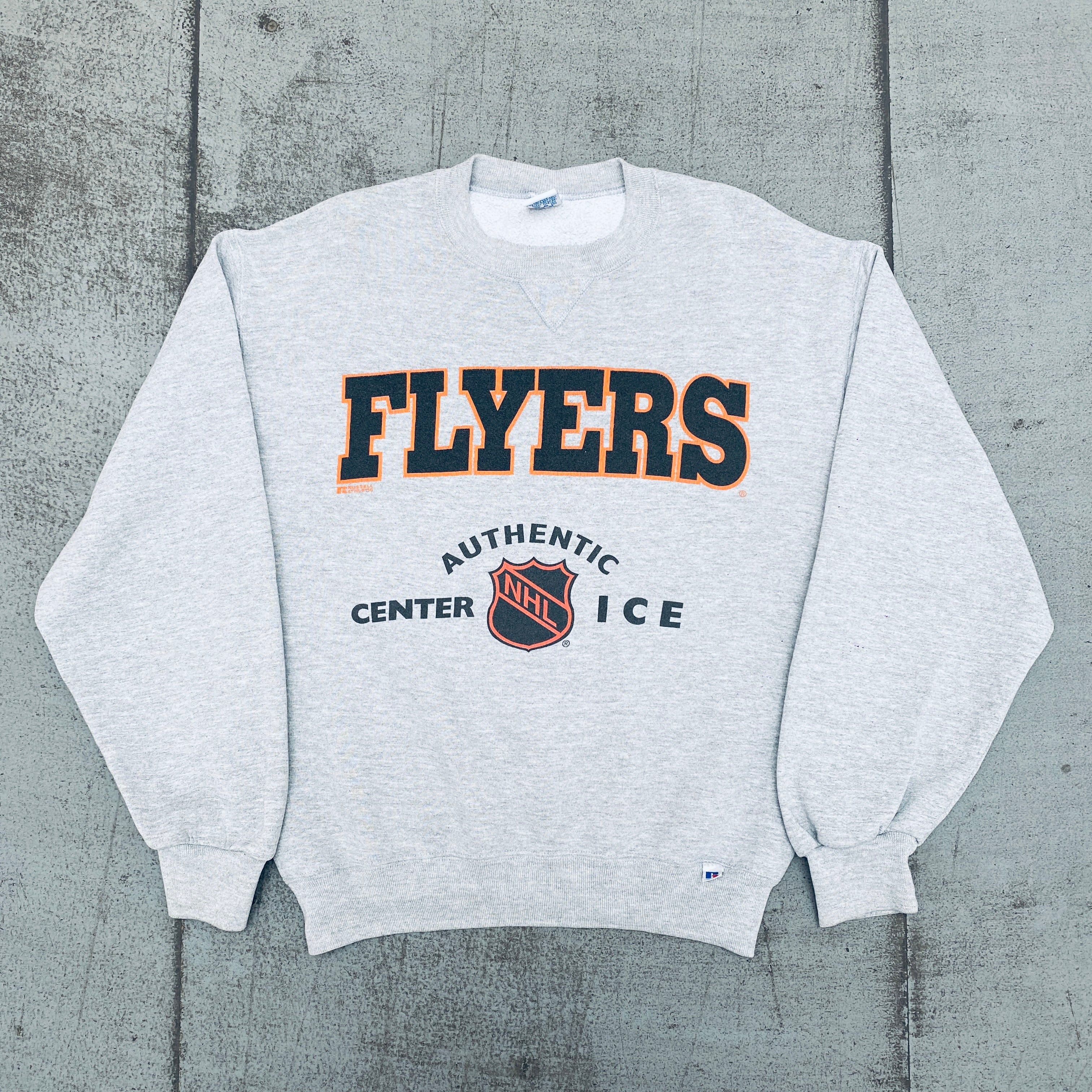 Philadelphia Flyers 1990s Vintage Russell Athletic Center Ice Graphic Spellout Sweatshirt (Medium) - Retro NHL Hockey Fan Gear for Game Day & Casual Wear
