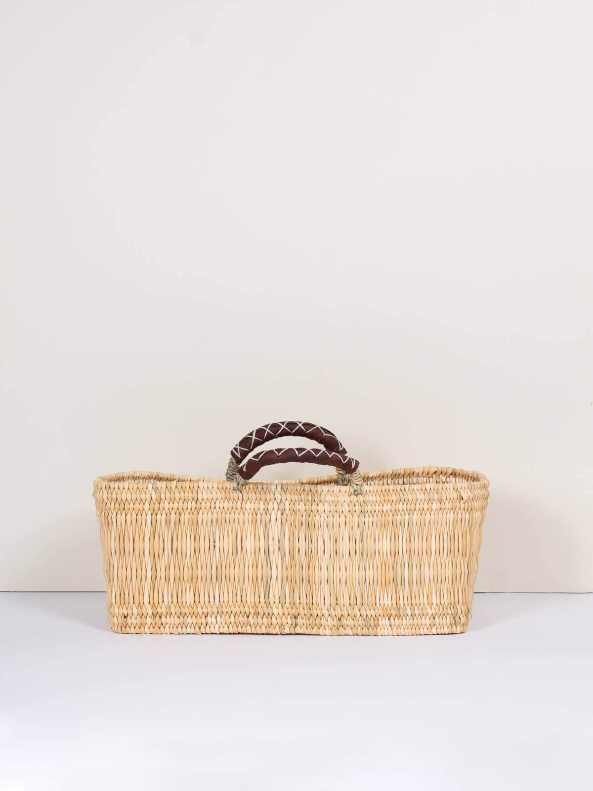 Handwoven Reed Basket with Genuine Leather Handles - Natural Woven Storage Bin for Home Decor, Laundry, or Picnic Basket - Perfect for Organizing Blankets, Toys, and More