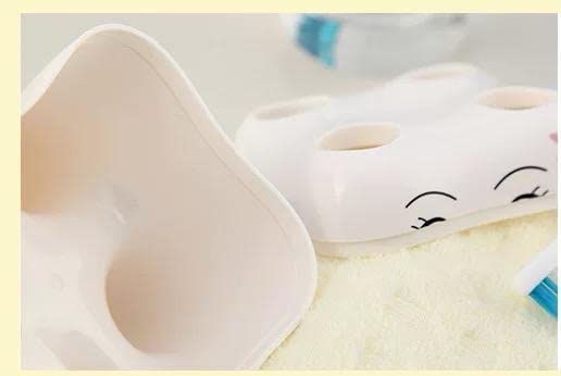 GB Quality 4-Hole Plastic Toothbrush Holder - Tooth-Shaped Bathroom Organizer with Cute Cartoon Design, White (Perfect for Kids' Bathrooms, Dormitories & Travel Storage)